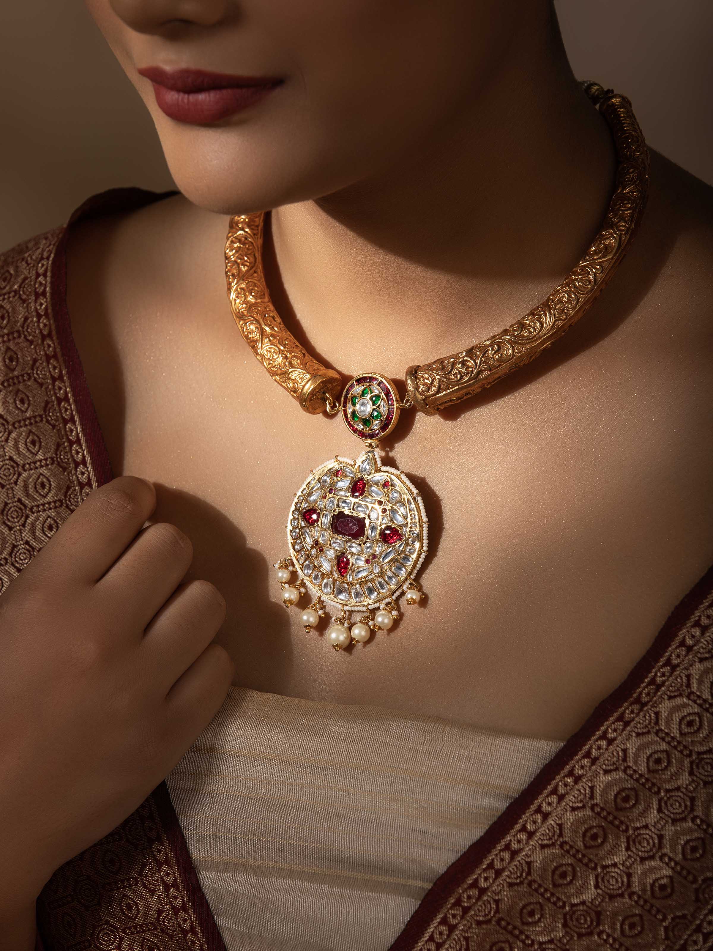 "Close-up of Bandhel metal collar necklace showing intricate metalwork"