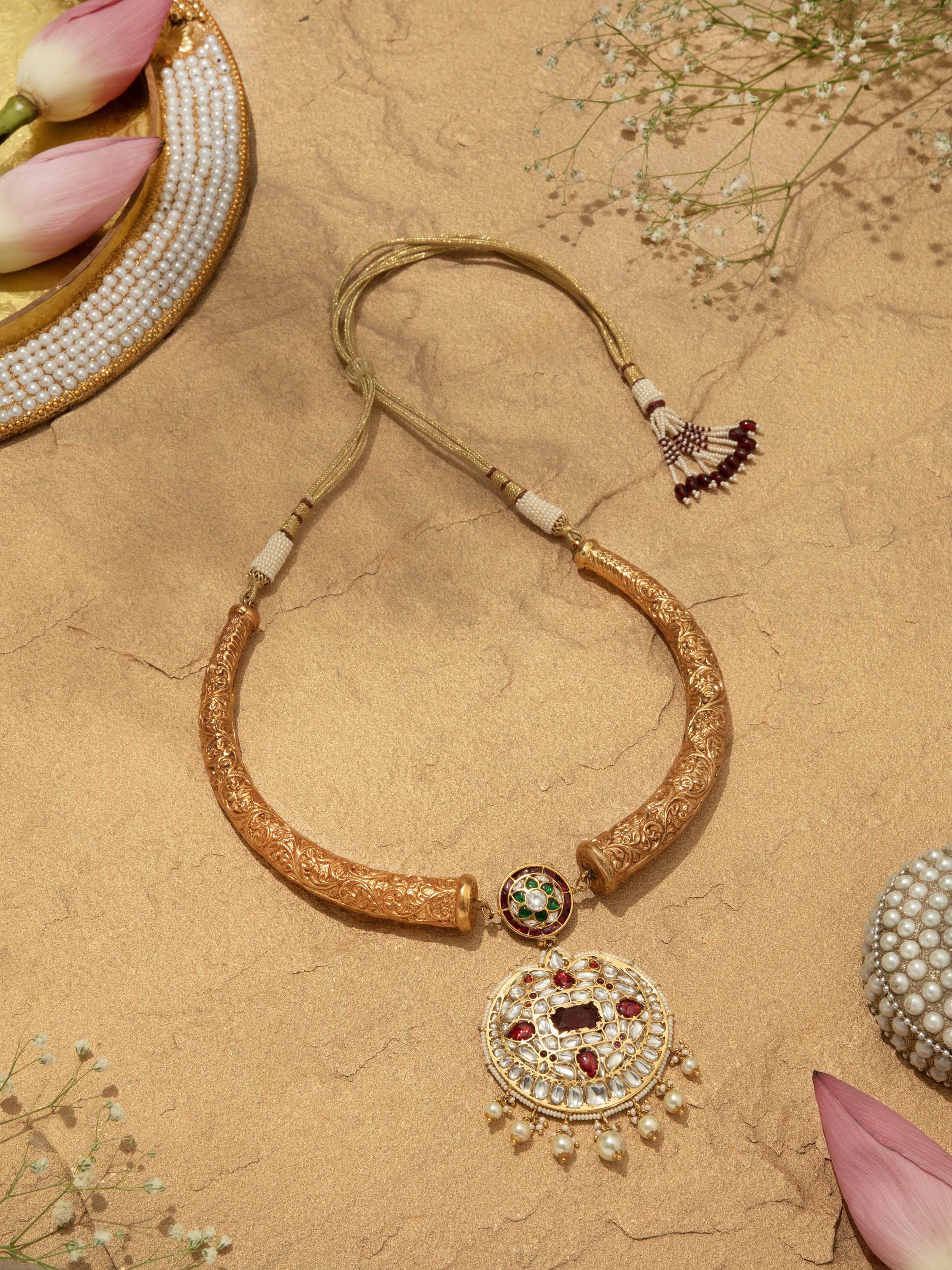 "Overhead view of Bandhel metal collar necklace showcasing design"