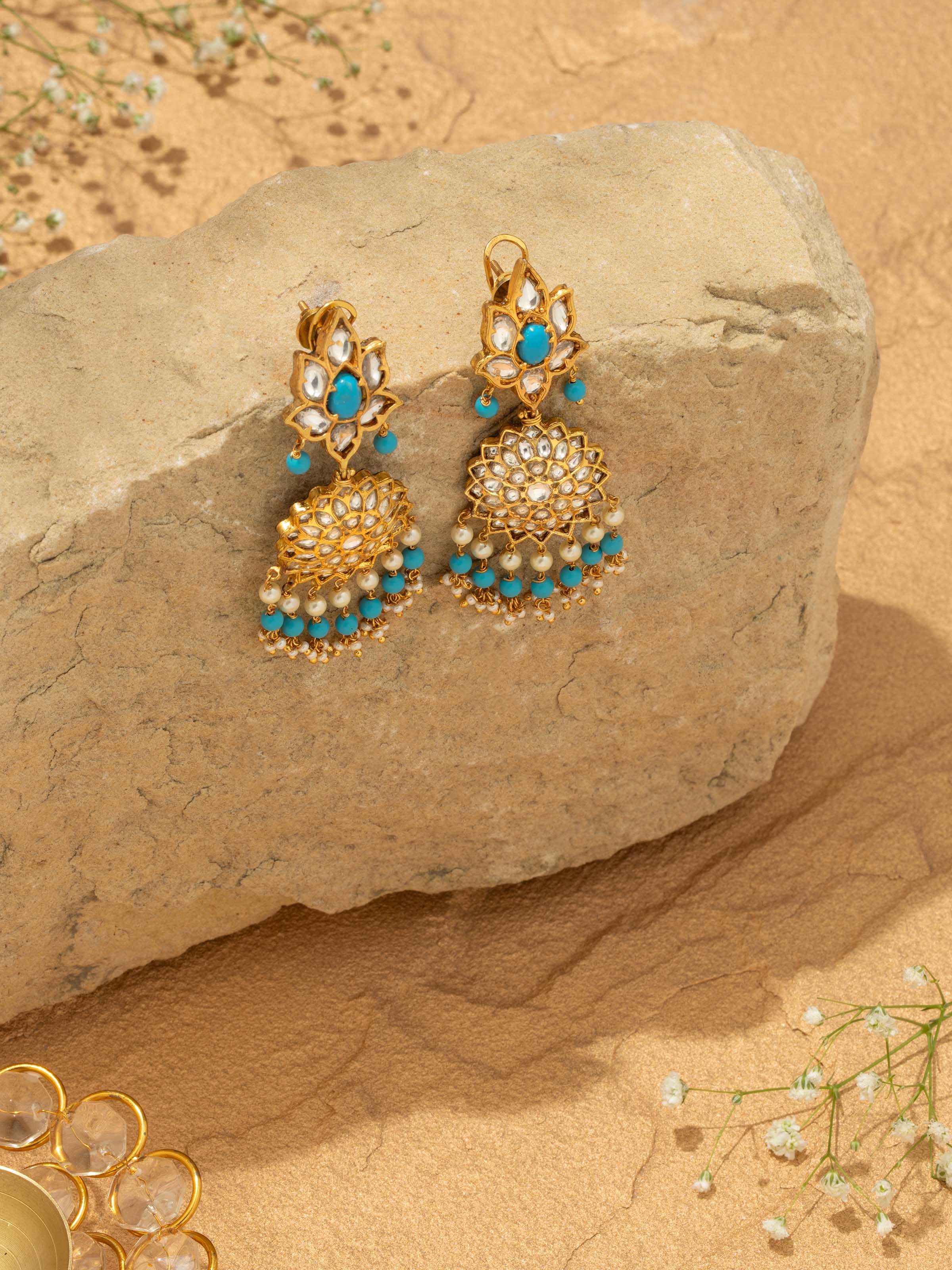 Overhead view of Bandhel metal drop earrings displaying the overall shape and style