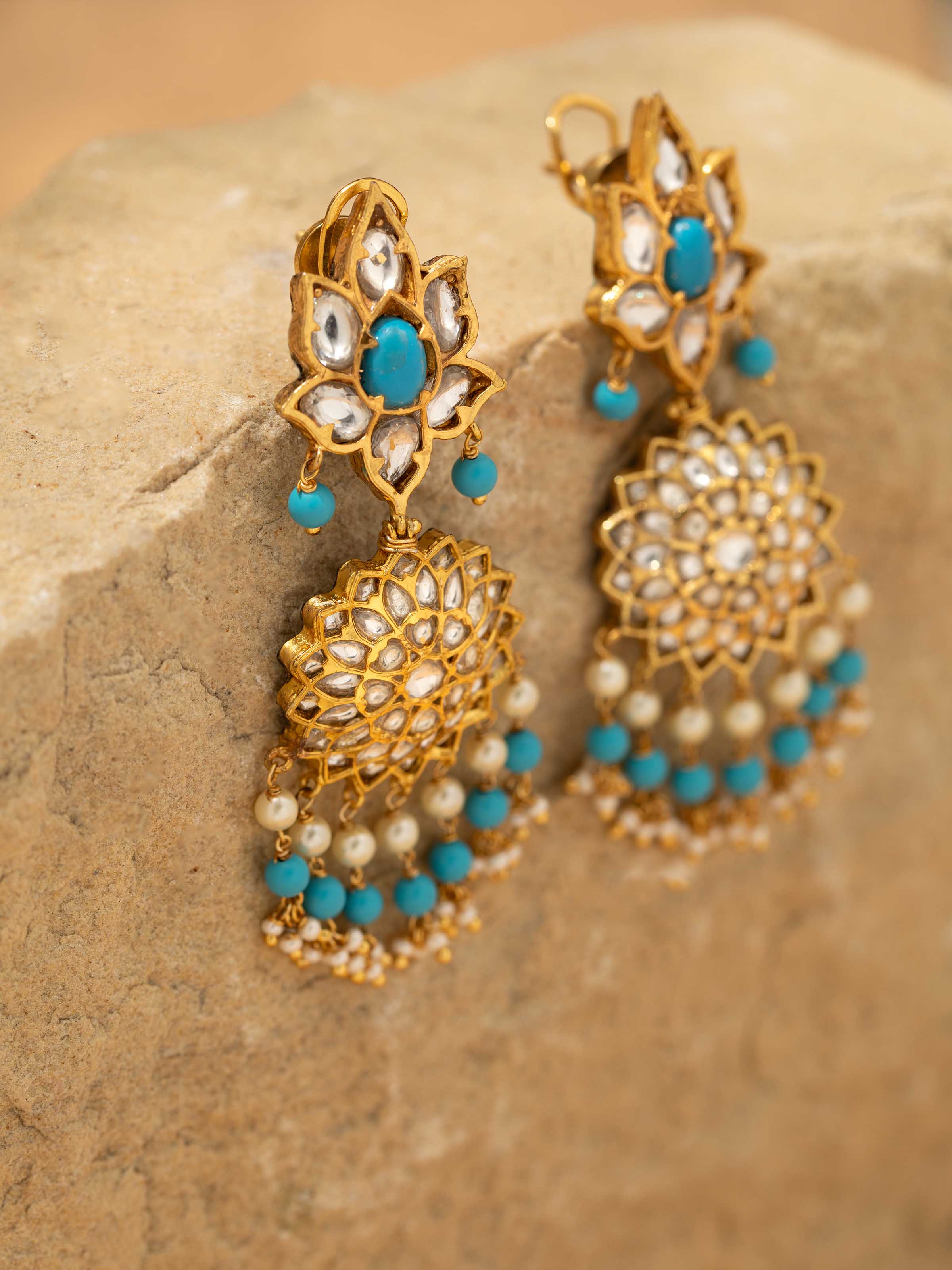 Detailed shot of Bandhel metal drop earrings highlighting fine detailing and design