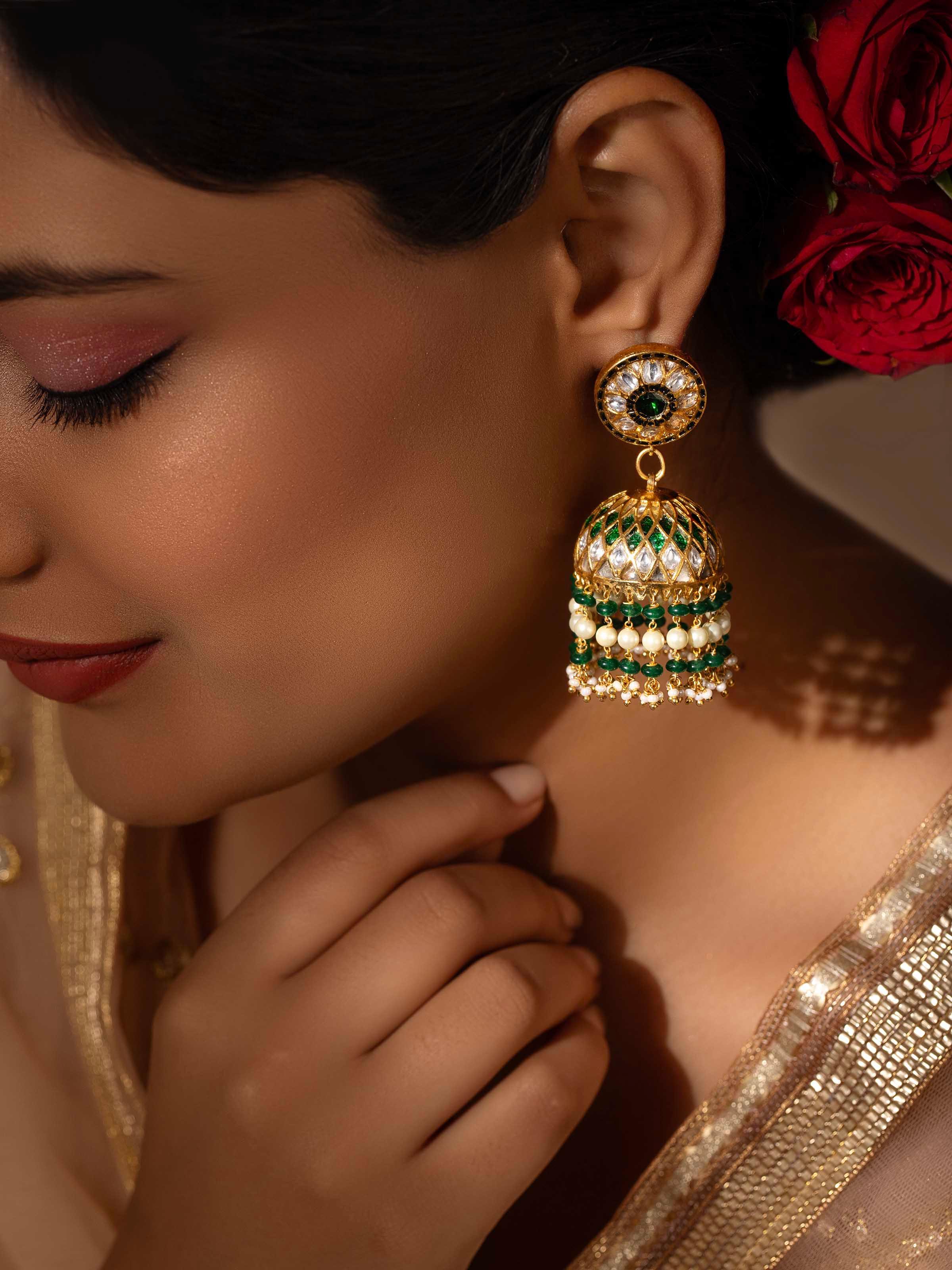 Lifestyle view of Bandhel Metal Jhumkas styled with ethnic outfit for a festive look.