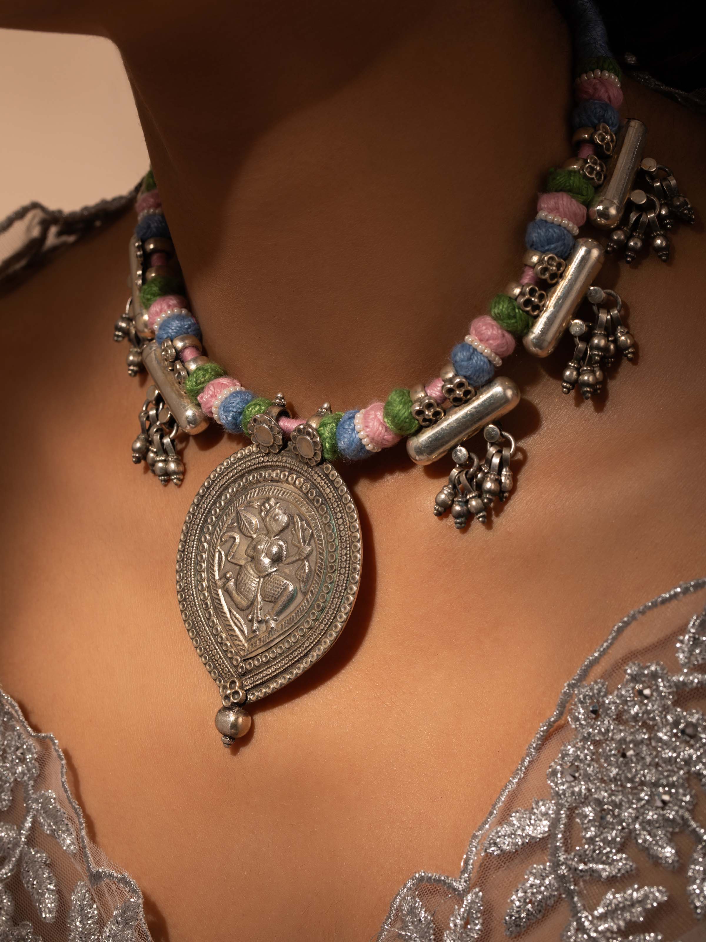 Side view of Silver Smithing Collar Necklace showcasing its smooth surface and refined design