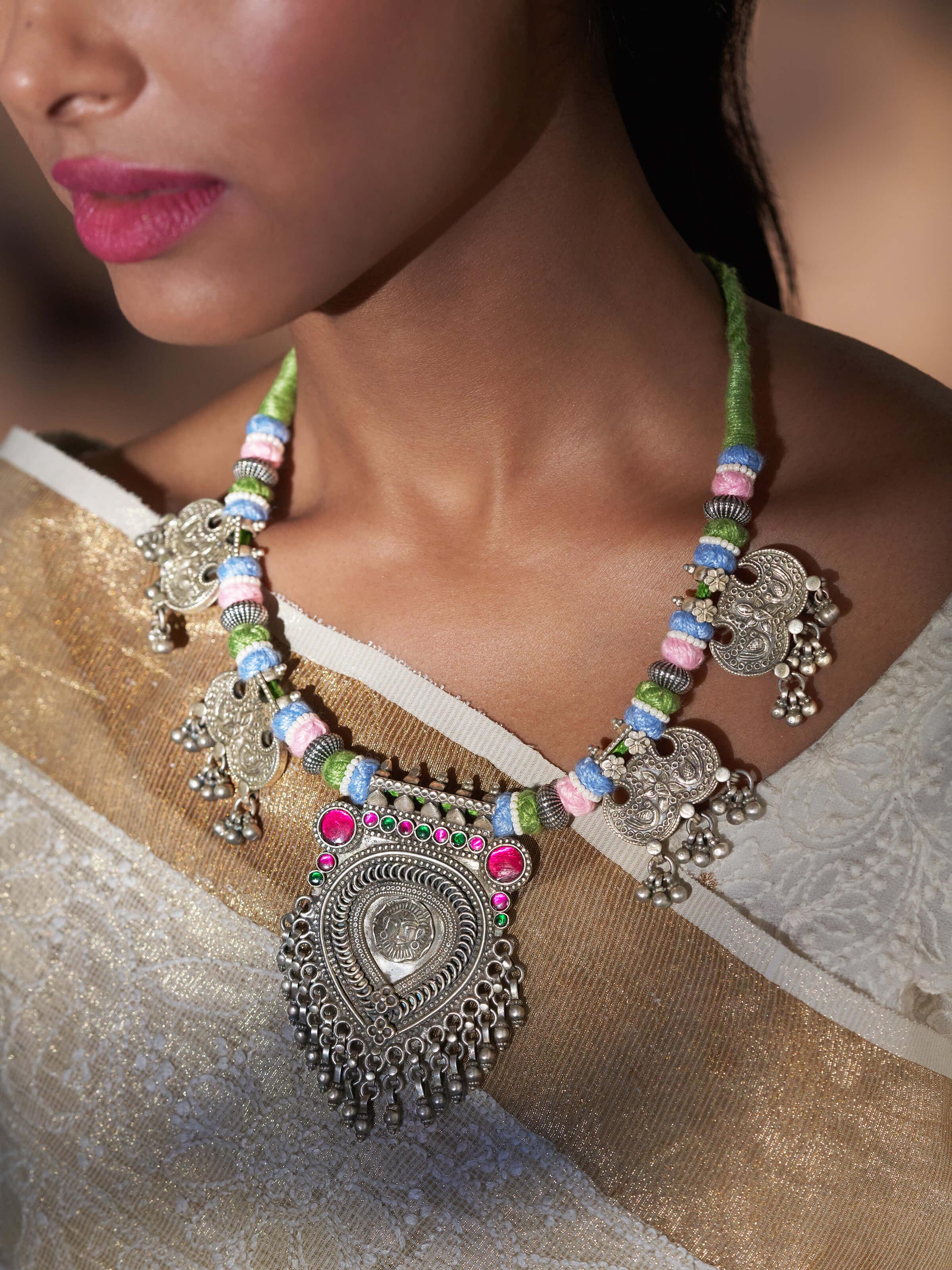 Angled view of Silver Smithing Collar Necklace highlighting the elegant design and finish.