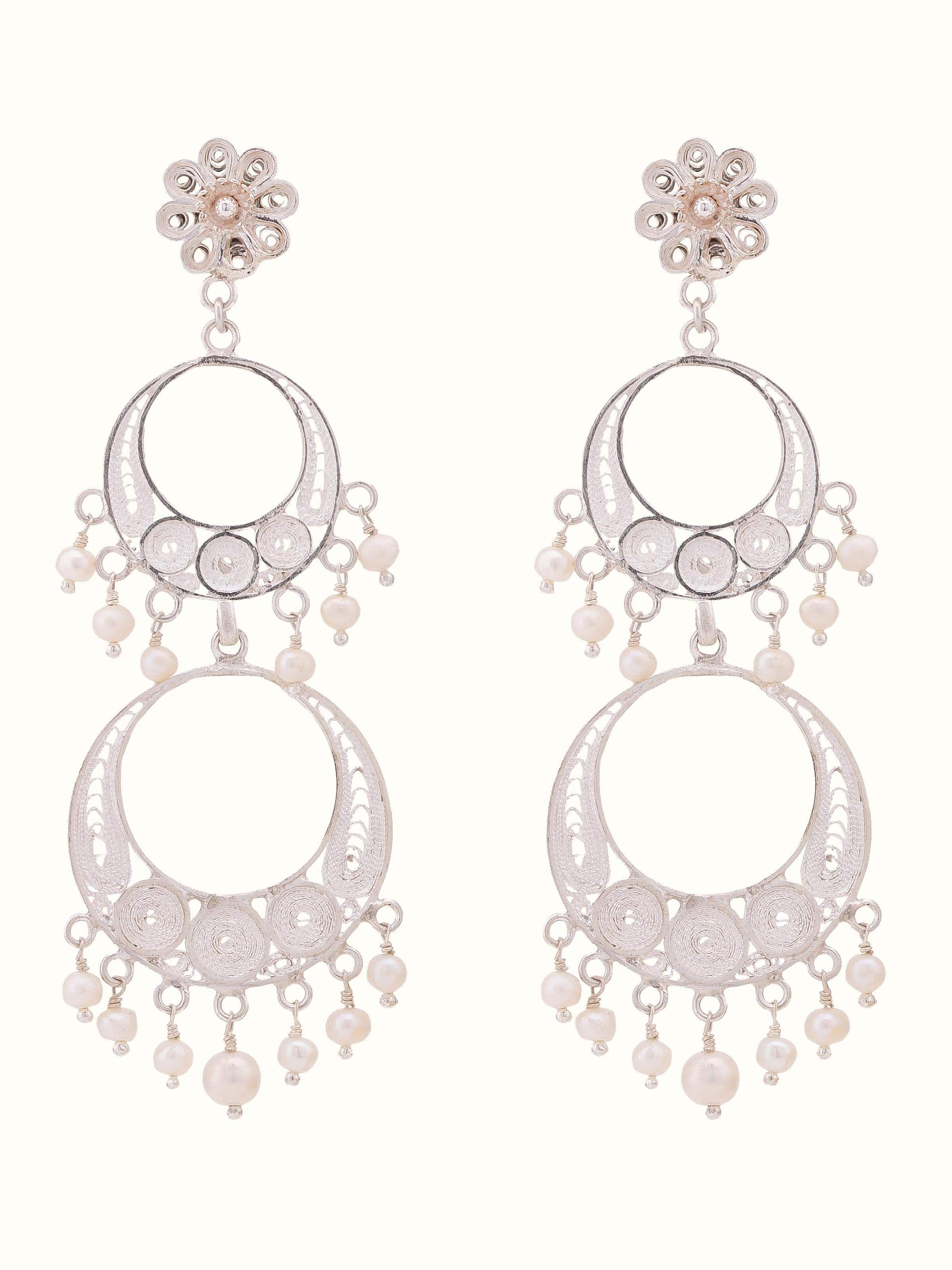 Front view of Silver filigree drop earrings featuring intricate filigree design