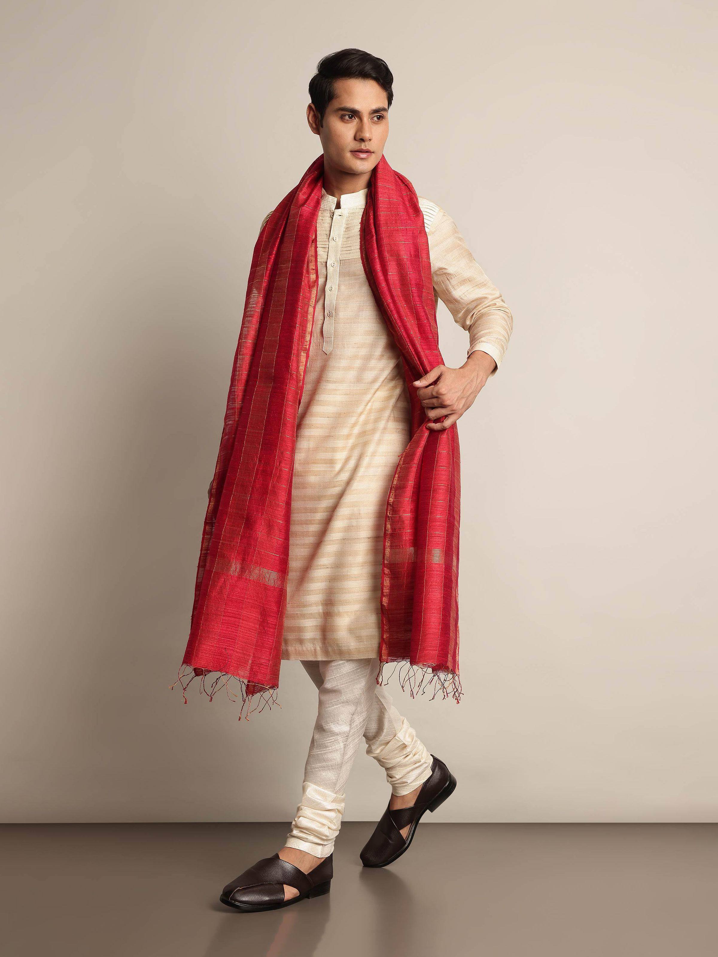 Side view of white silk churidar showcasing smooth Bhagalpuri fabric and fitted silhouette.