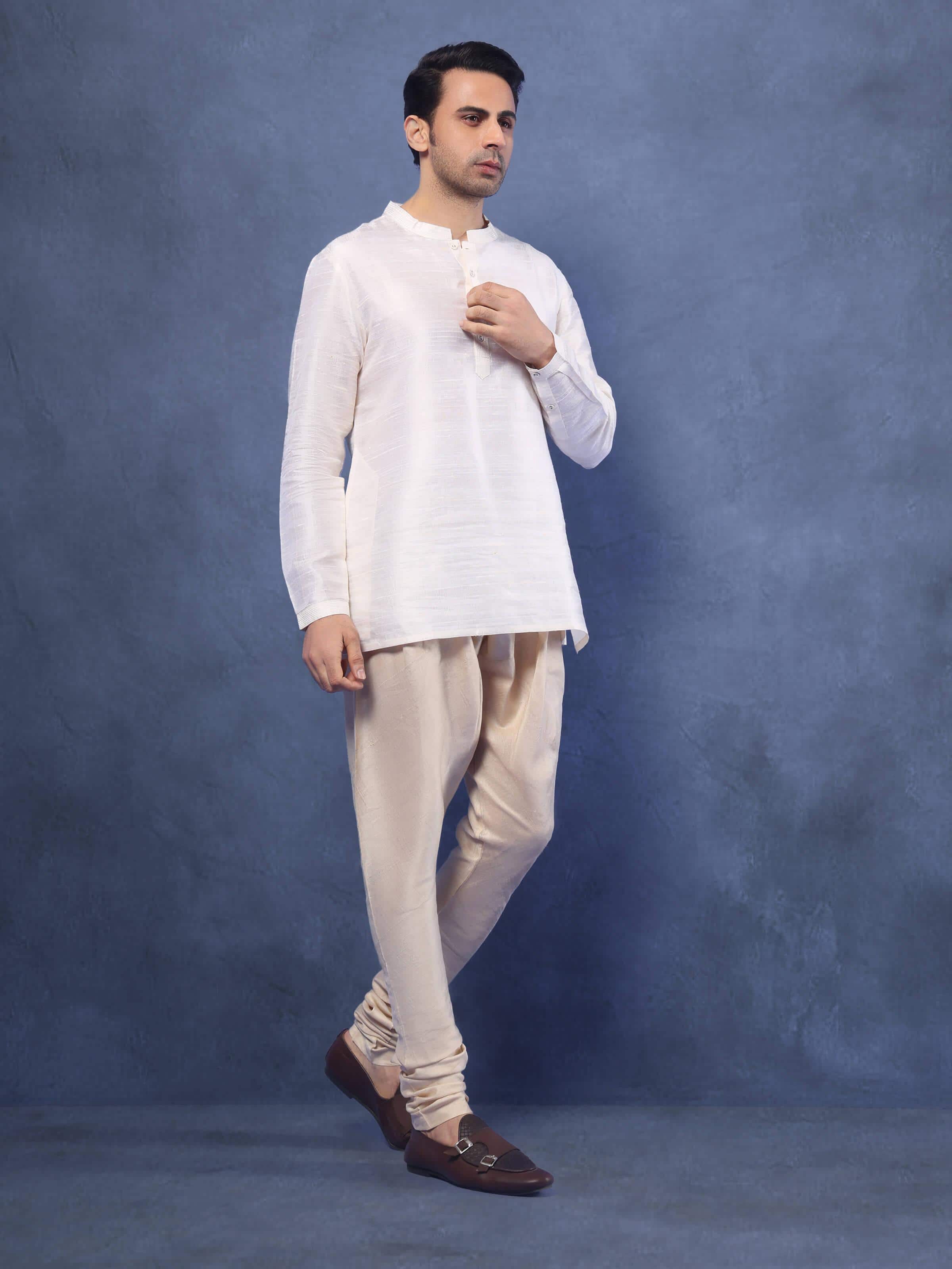 Lifestyle view showing churidar paired with a silk kurta and dupatta.