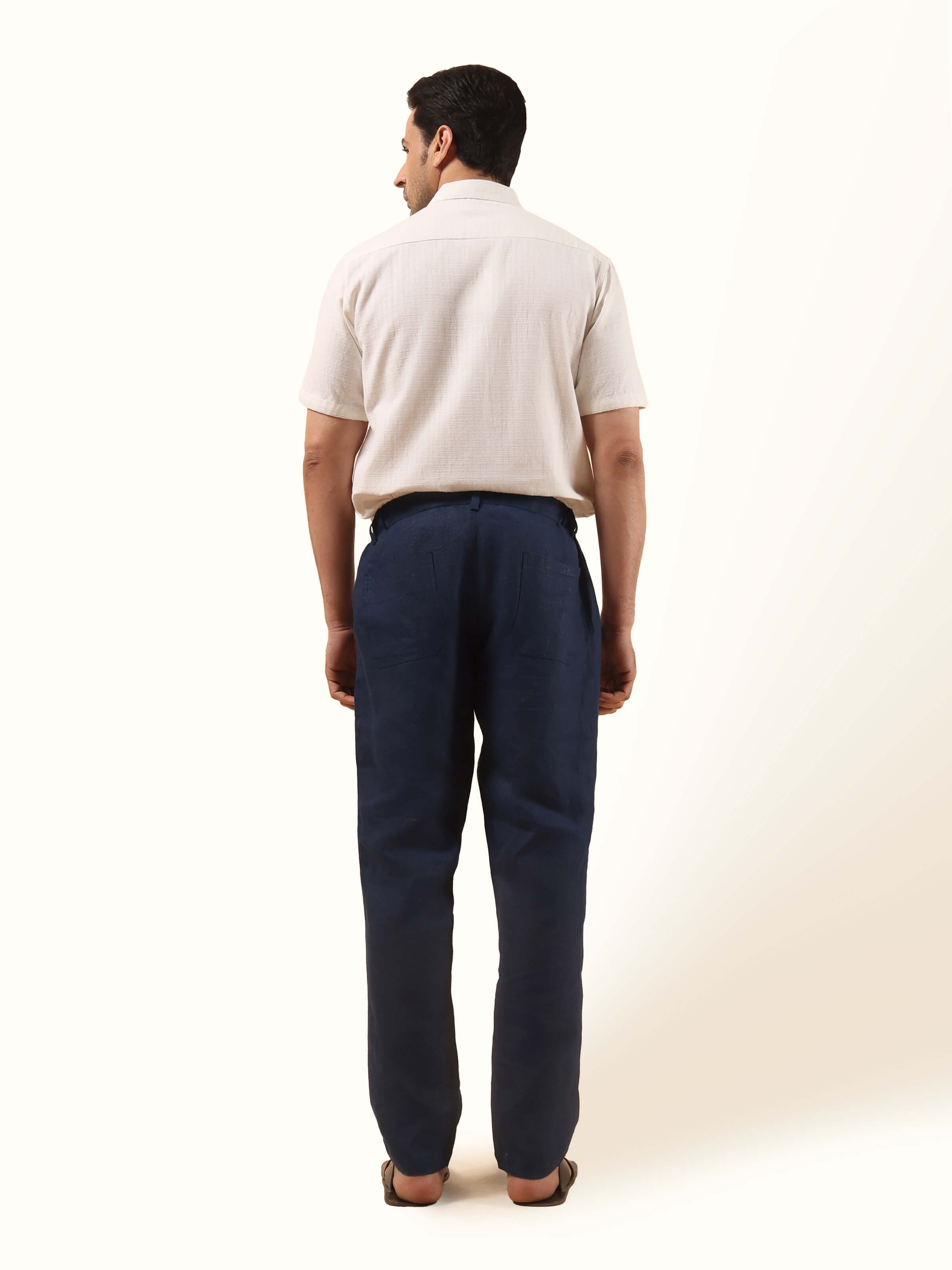 Back view of navy blue linen elasticated pant displaying elastic waistband and simple back profile.