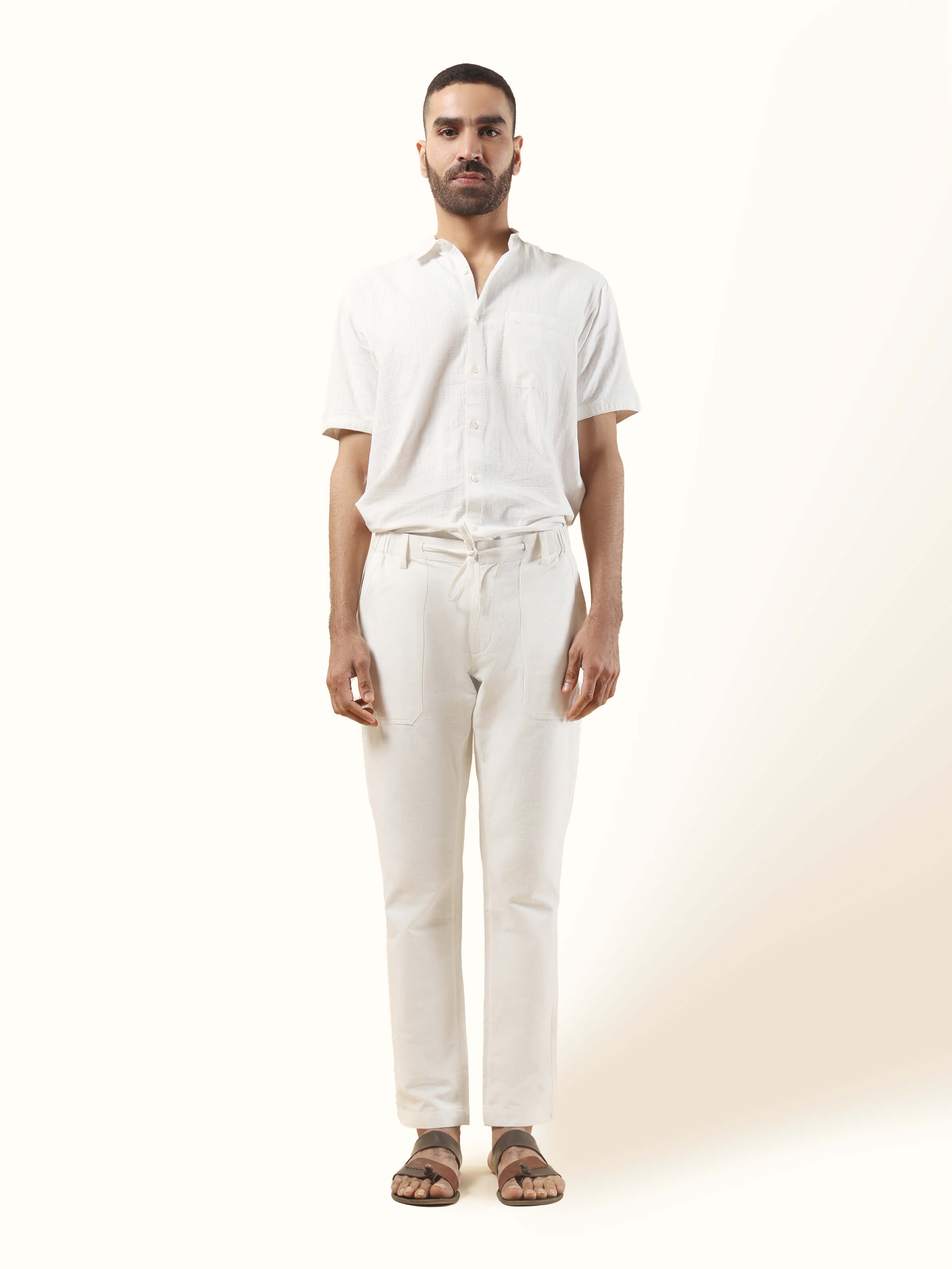 Front view showcasing the comfortable elasticated waist and versatile off-white cotton.