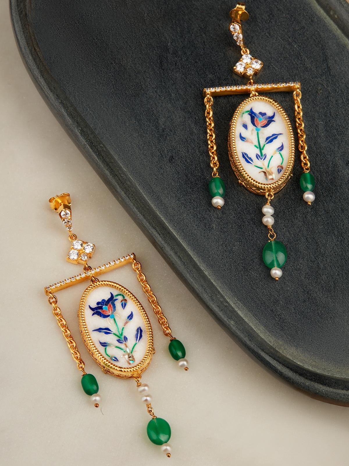 Close-up of Pacchikari Silver Drop Earrings highlighting the detailed silverwork and elegant drop design.