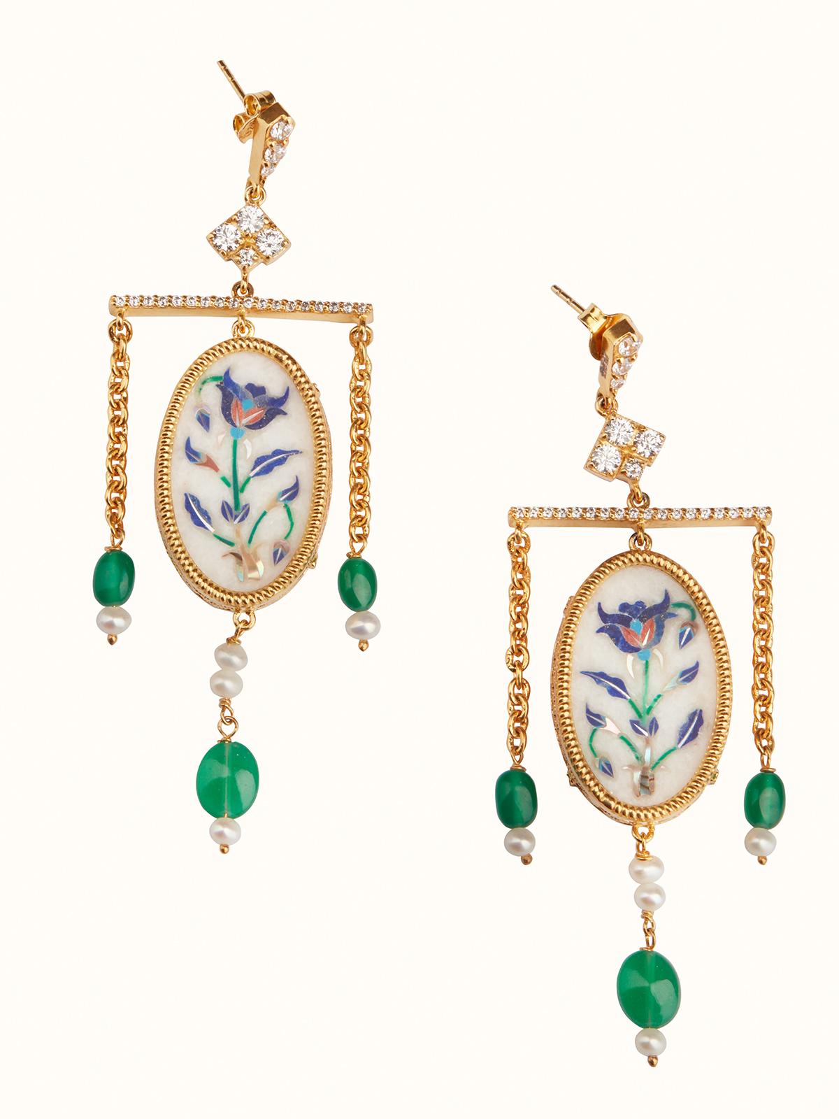 Side view of Pacchikari Silver Drop Earrings showcasing the unique silver design and drop feature.