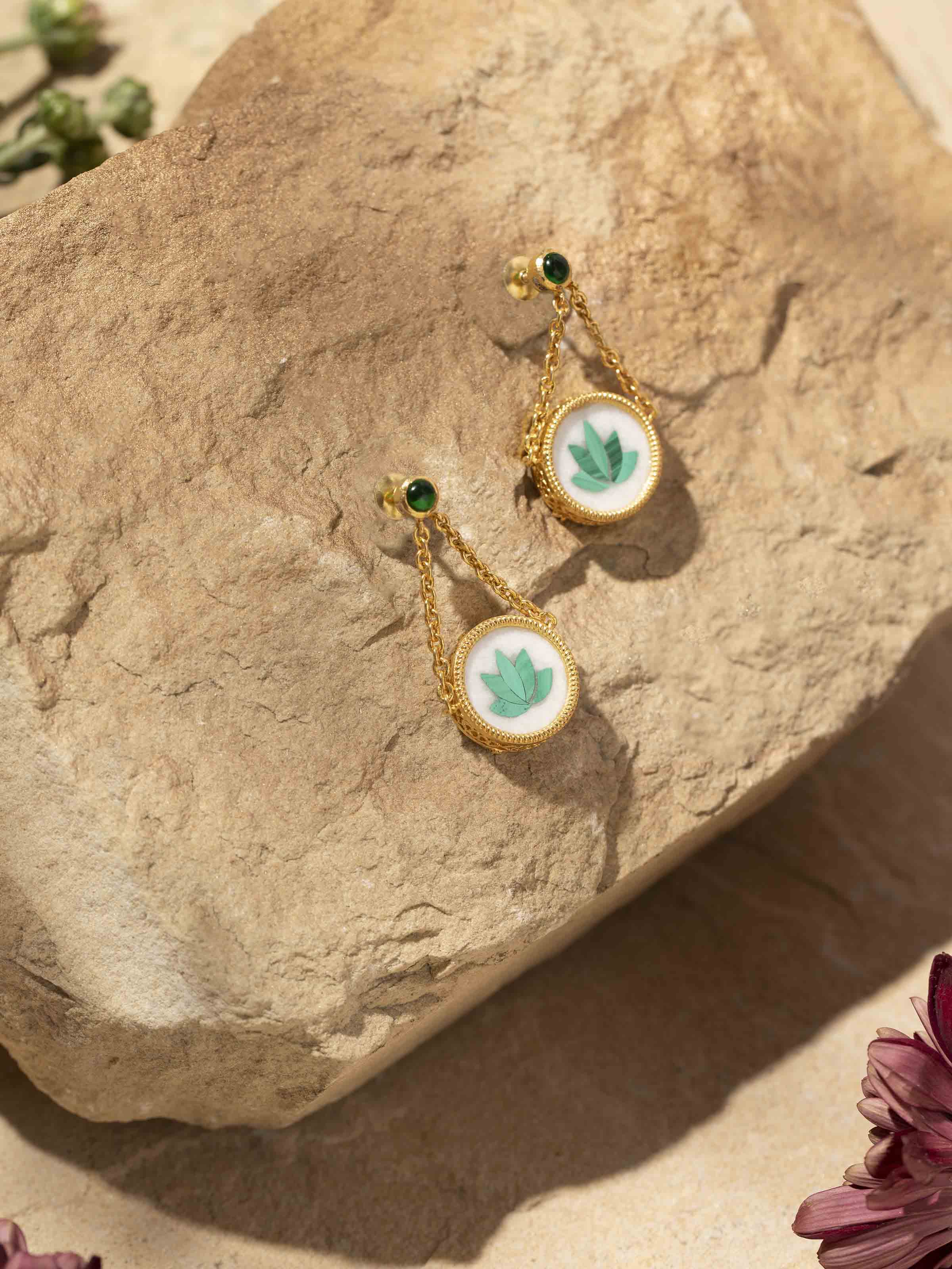 Side view of Pacchikari silver drop earrings emphasizing their elegant drop shape and craftsmanship.