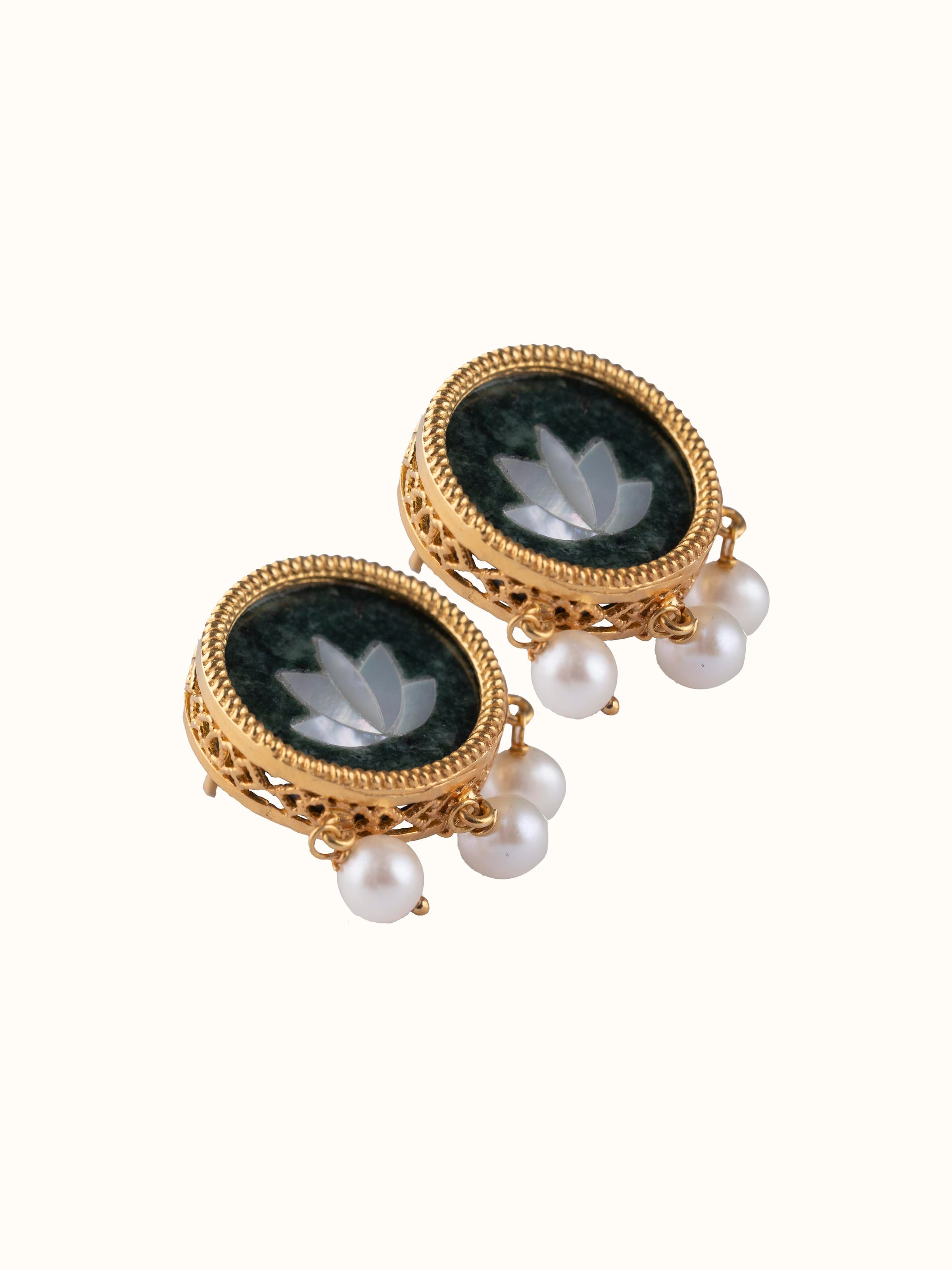Overhead view of Parchinkari earrings showing balanced design and silver gloss.