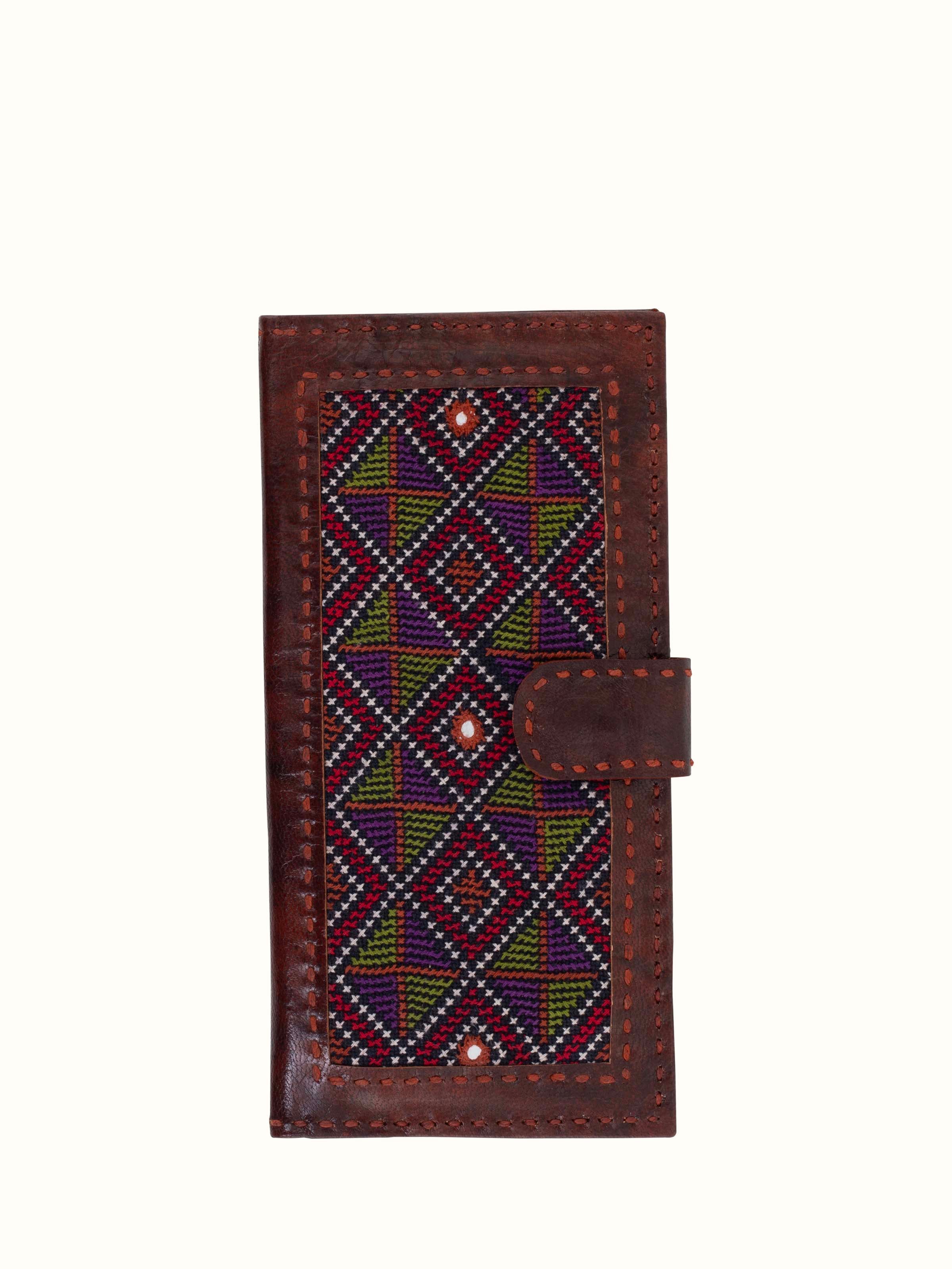 Front view of Kutchi leather embroidered clutch showcasing detailed embroidery and leather texture
