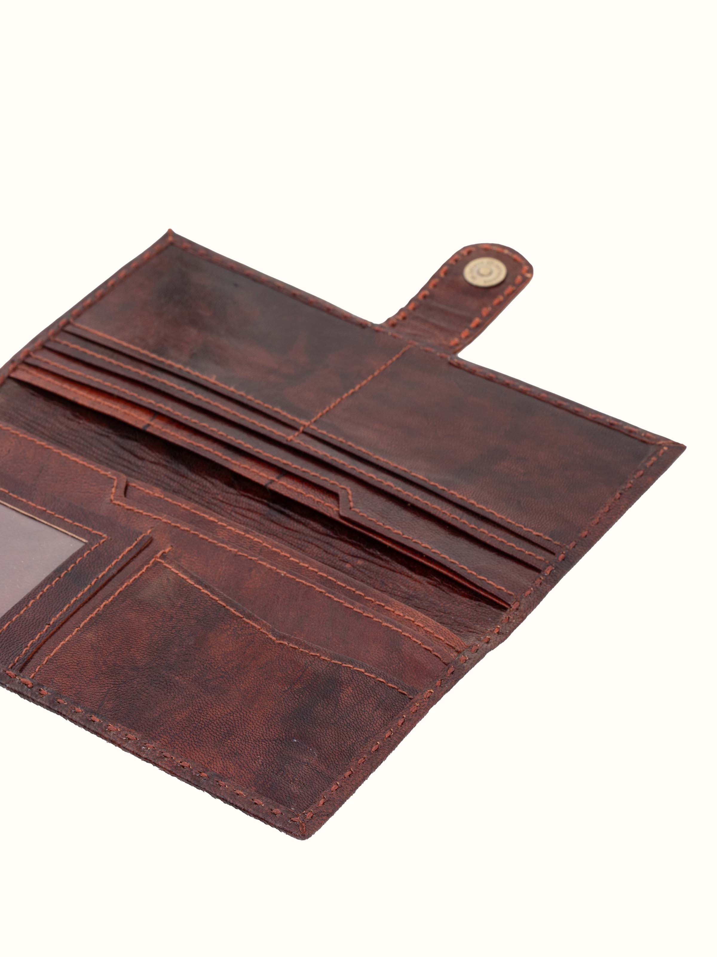 Back view of Kutchi leather embroidered clutch showcasing the design and closure details