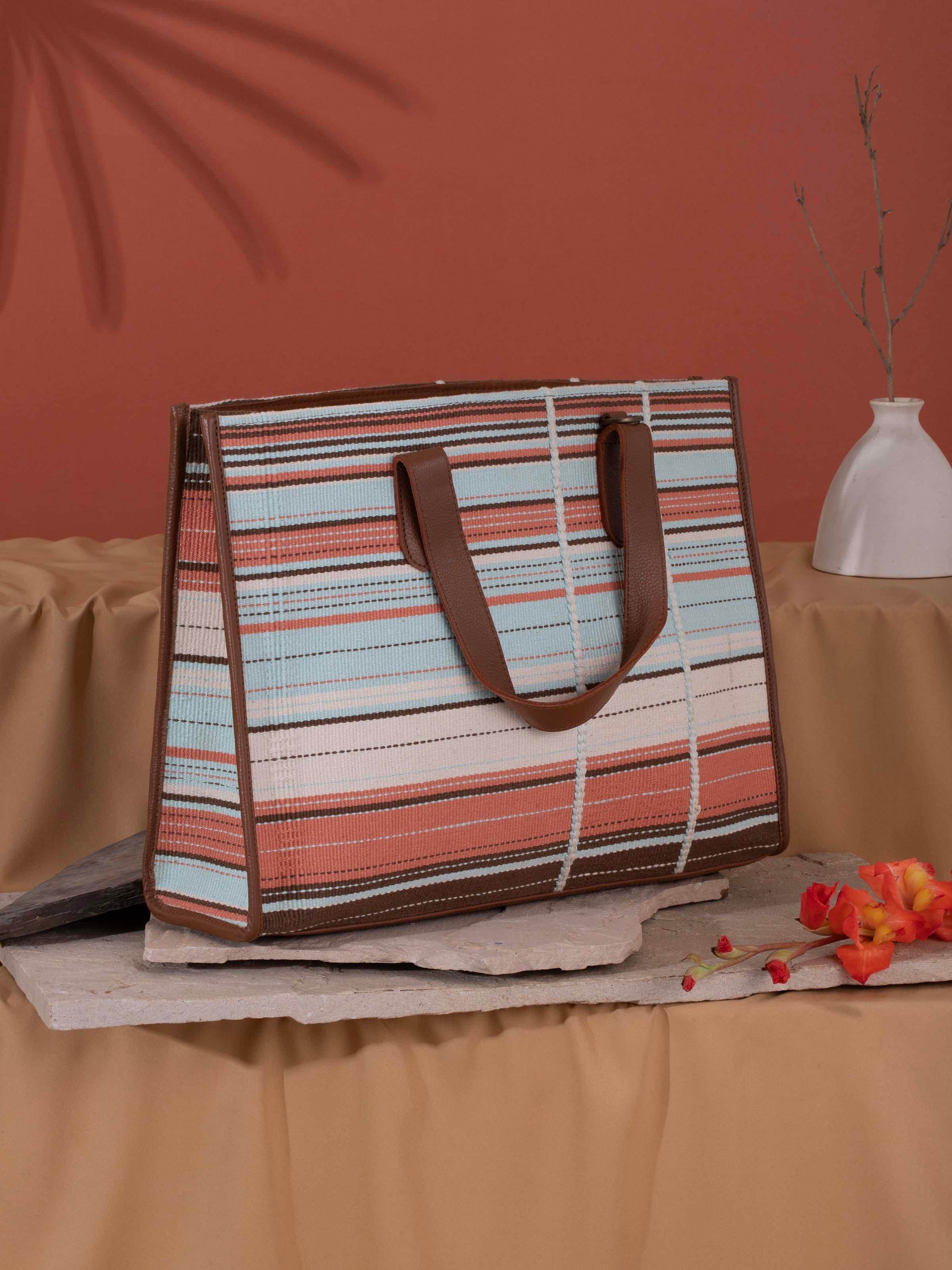 Side view of multicolor leather & textile Nagaland loin loom tote bag highlighting detailed craftsmanship