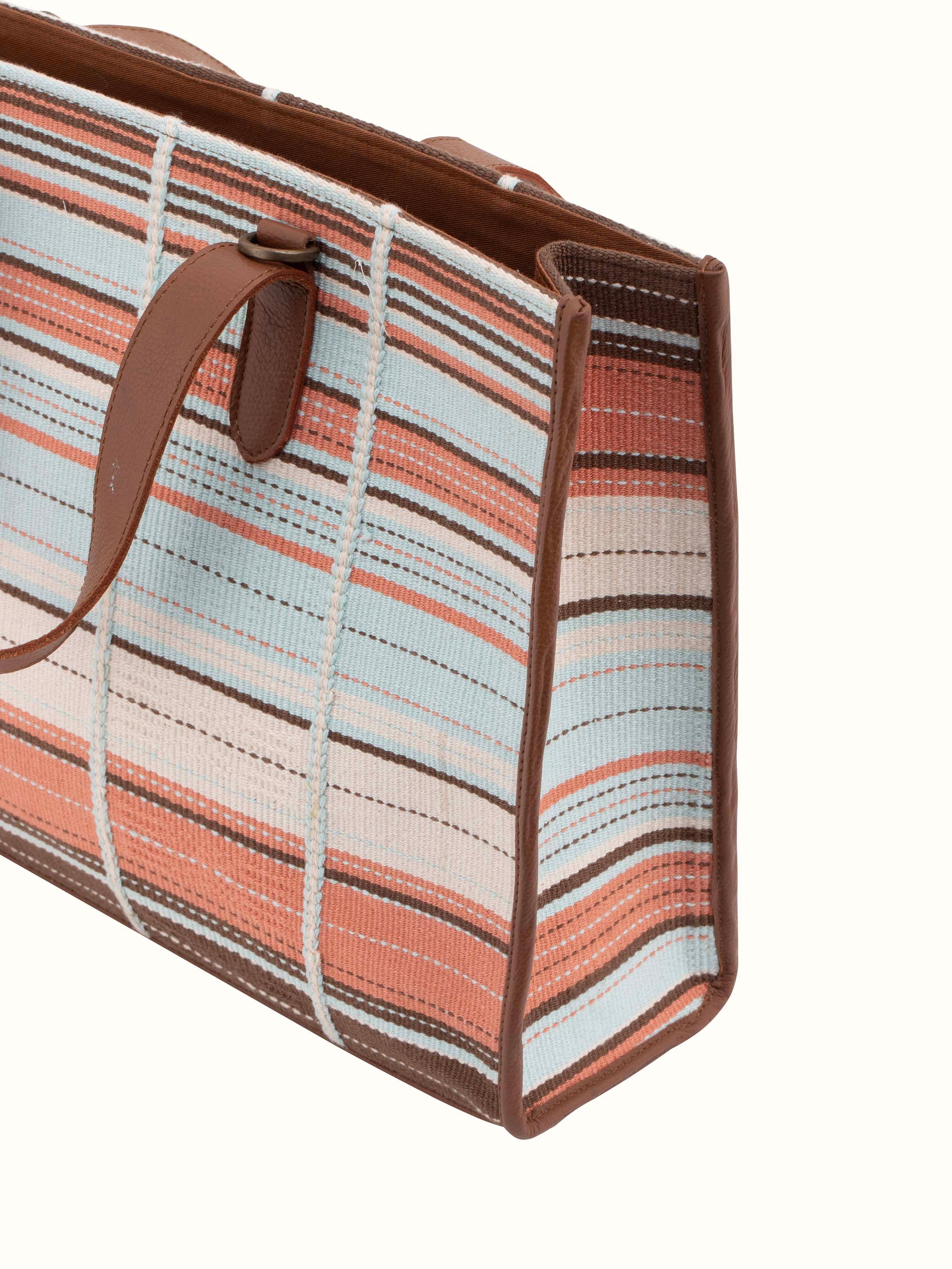 Back view of multicolor leather & textile Nagaland loin loom tote bag displaying overall design