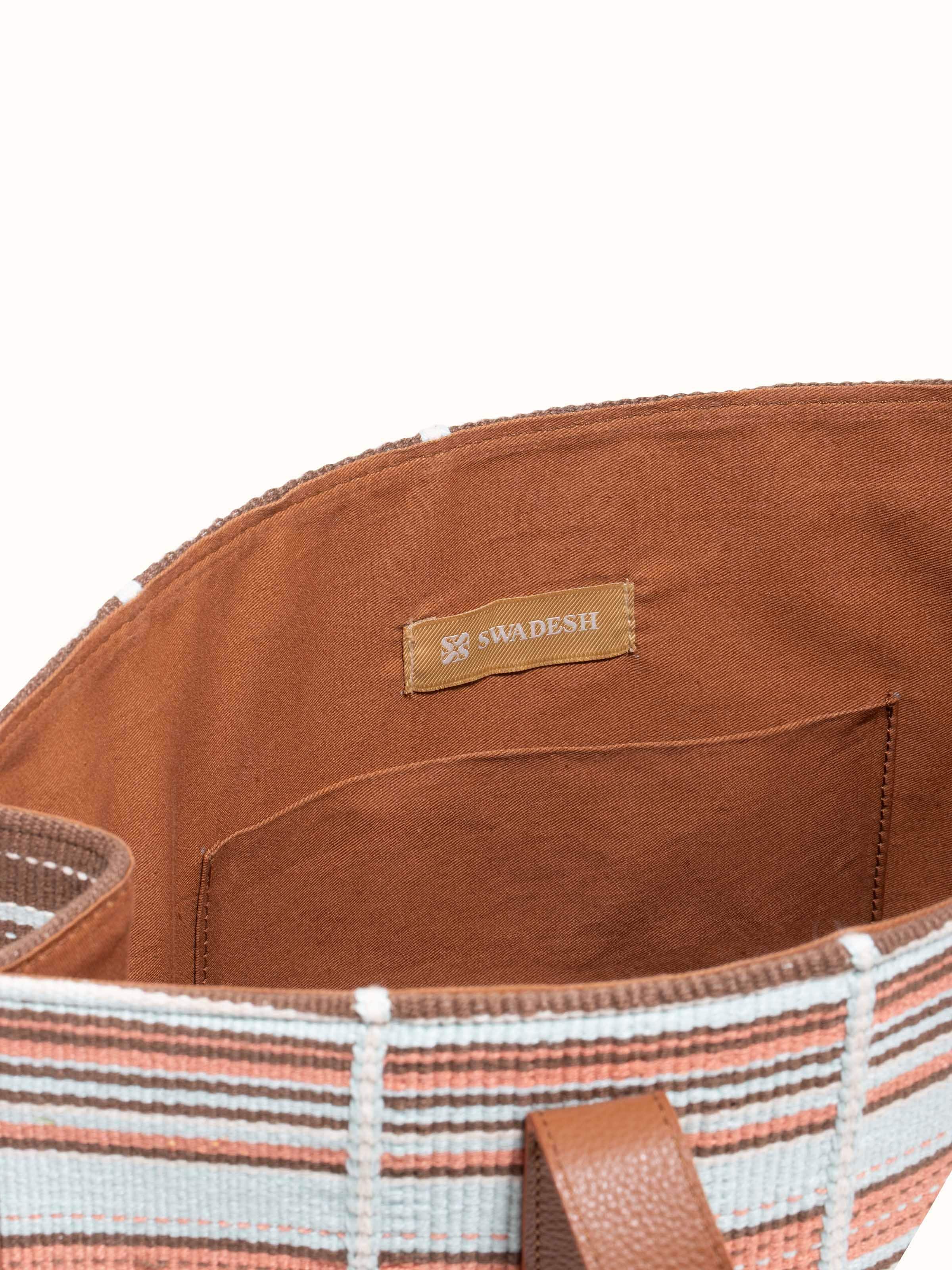 Detailed view of multicolor leather & textile Nagaland loin loom tote bag emphasizing intricate weaving