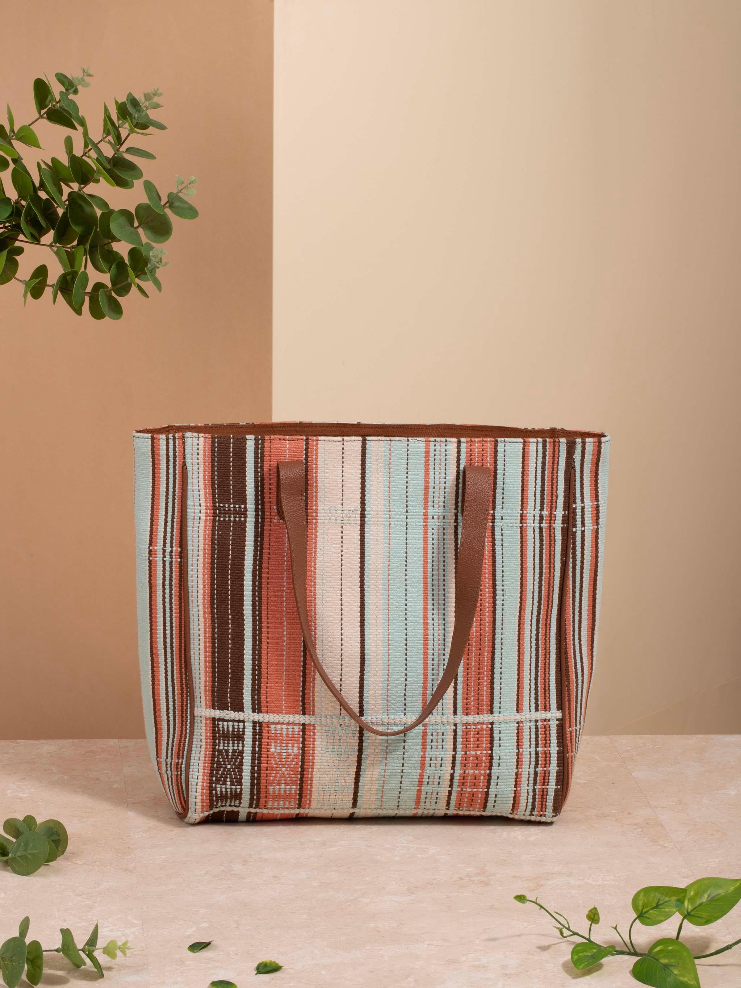 Side view of Leather & textile Nagaland loin loom tote bag highlighting design