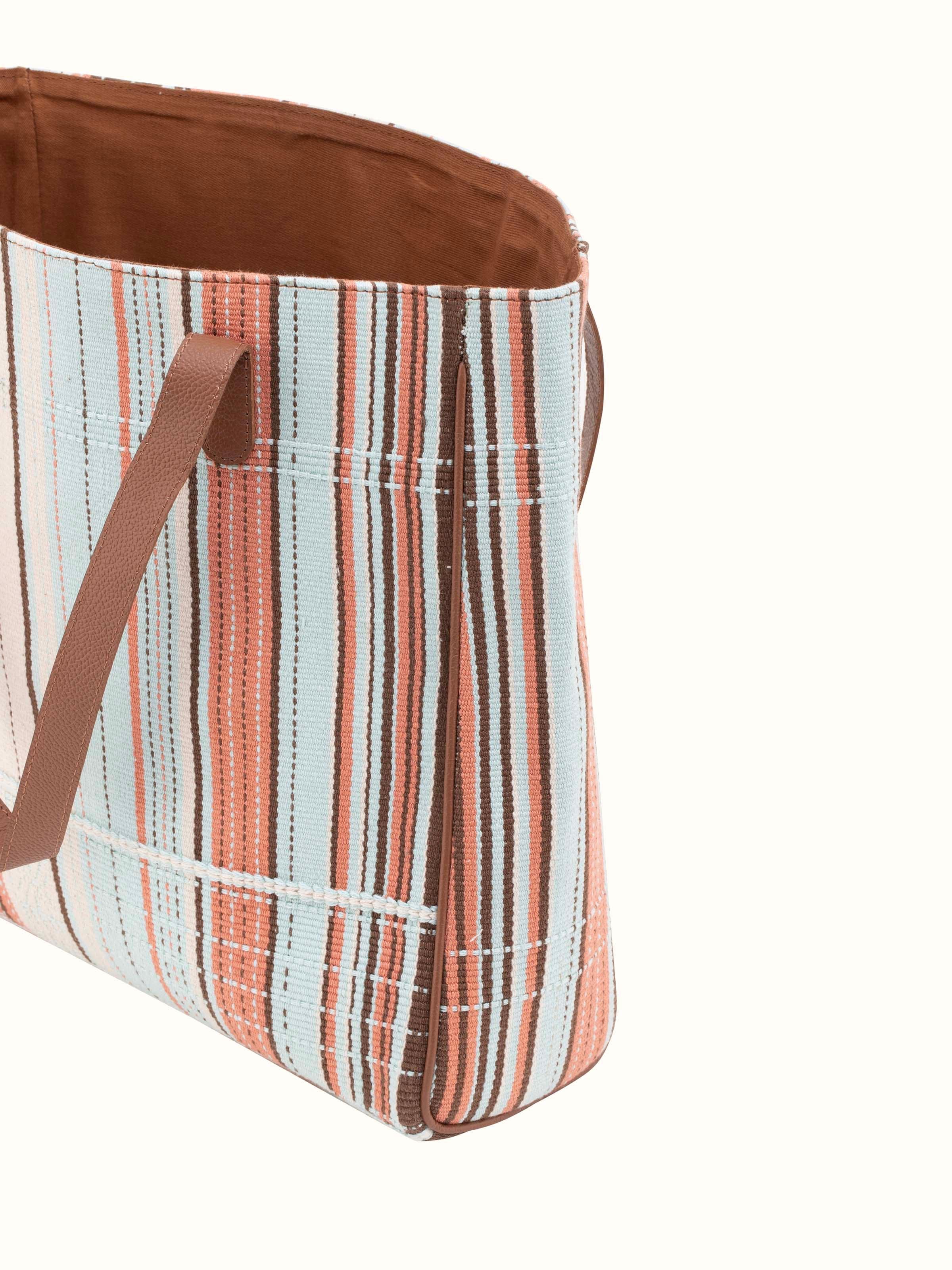 Angle view of Leather & textile Nagaland loin loom tote bag showing craftsmanship