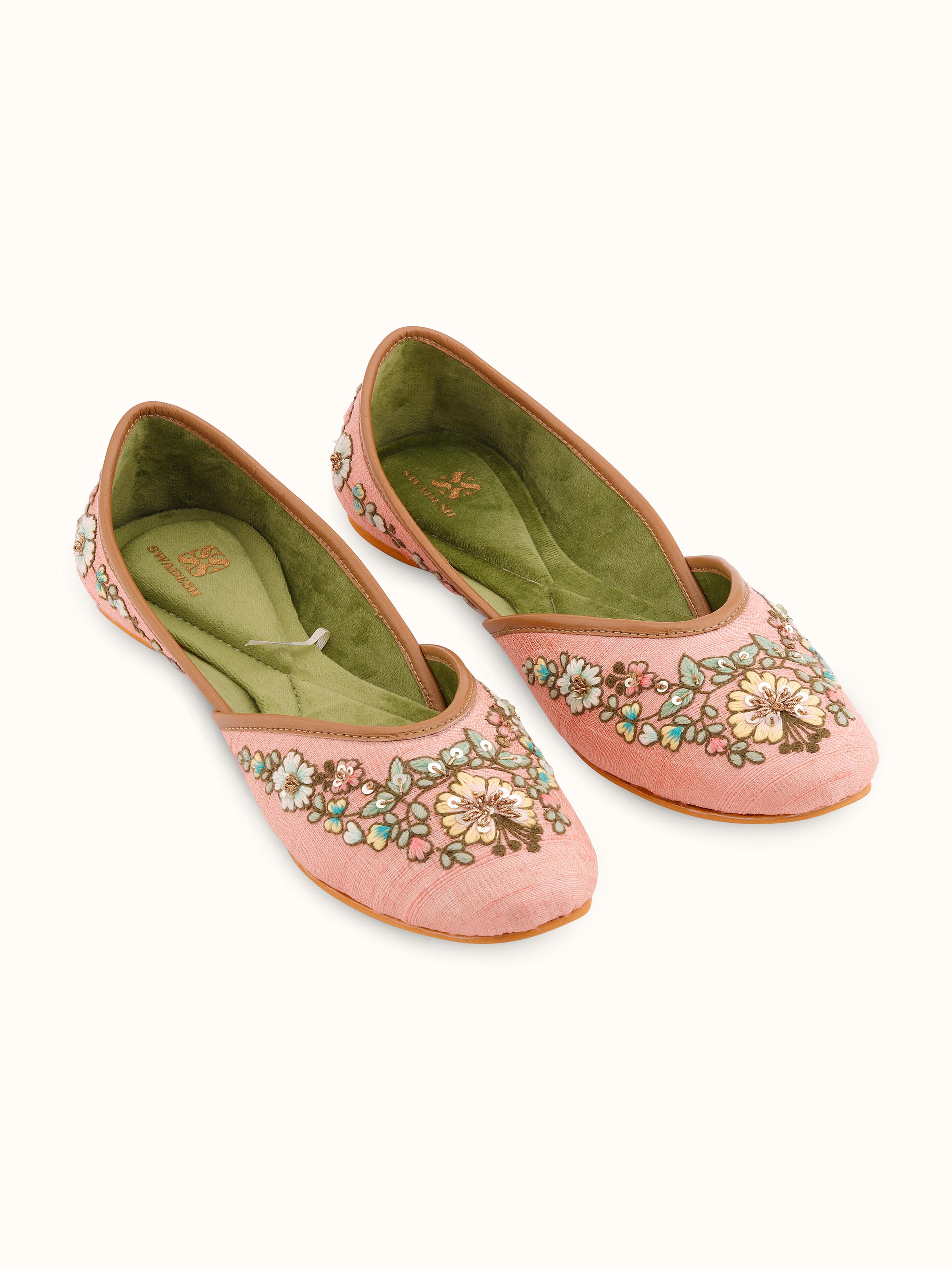 Front view of pink leather zardozi juttis showcasing intricate zardozi embroidery