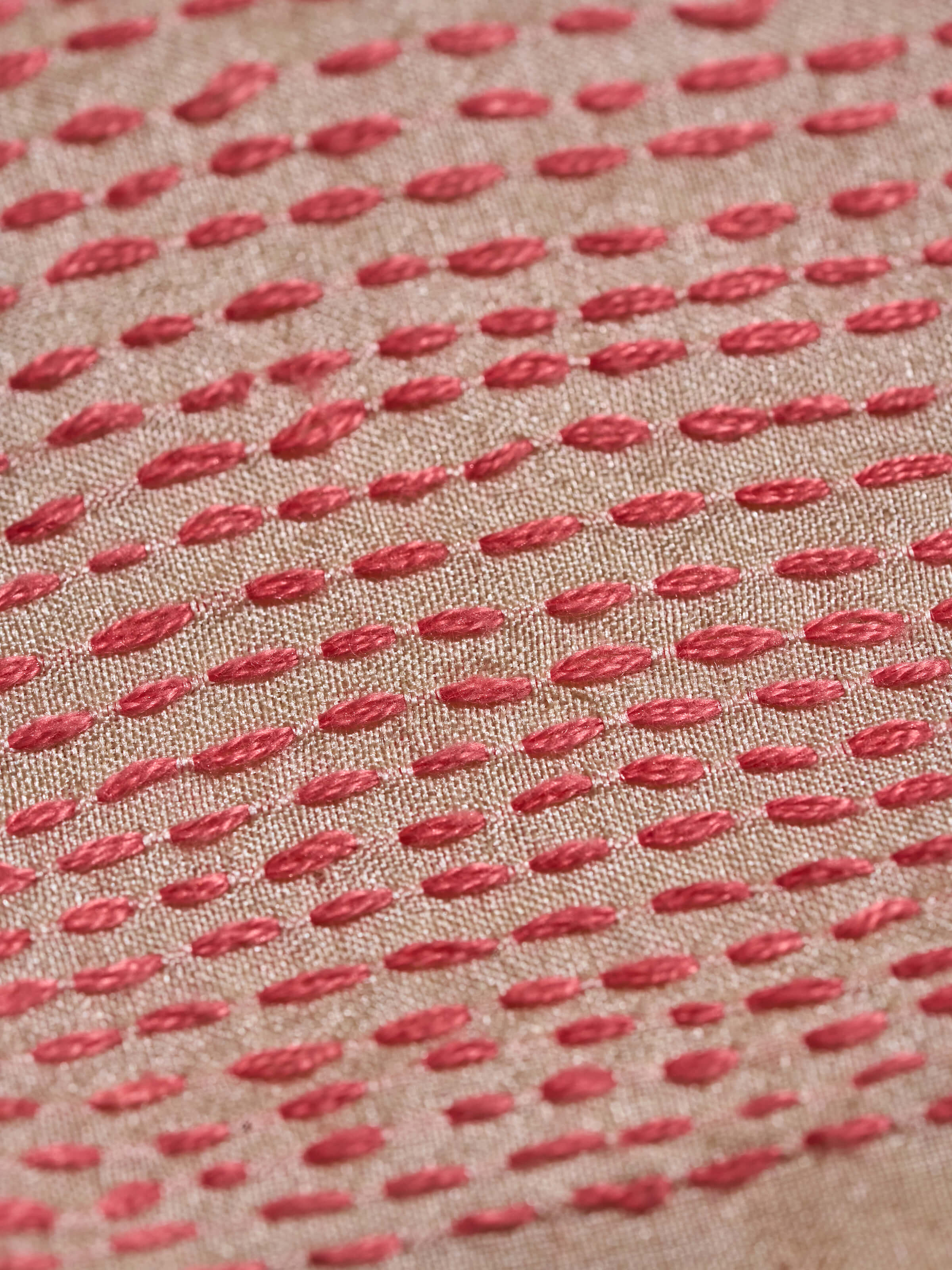 Detailed shot of the embroidery work on off-white tussar silk blouse piece highlighting craftsmanship.