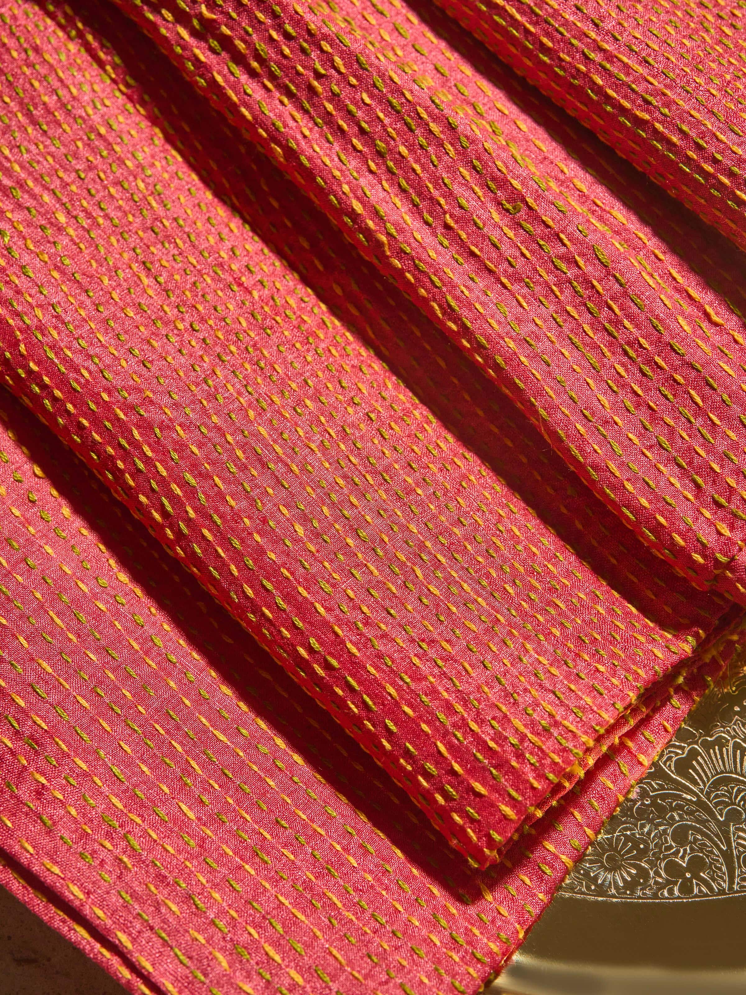 Close-up showing fine embroidery work and Tussar silk texture.
