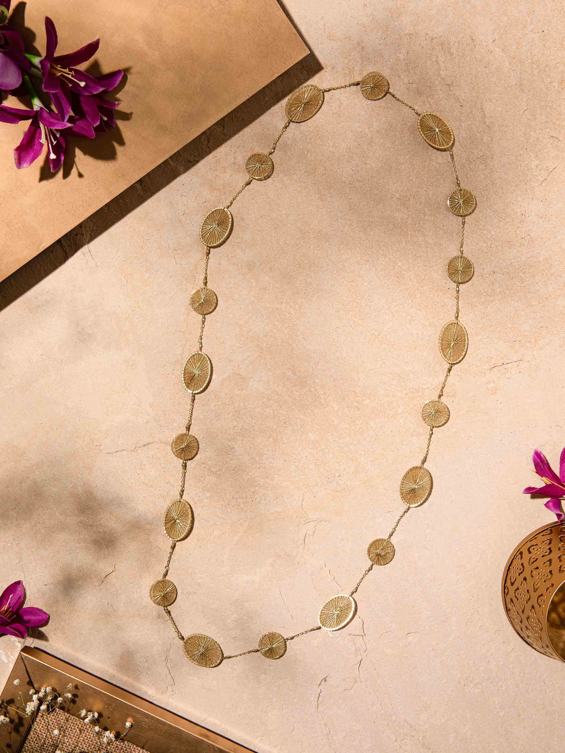 Close-up view of string craft long necklace highlighting its detailed beadwork
