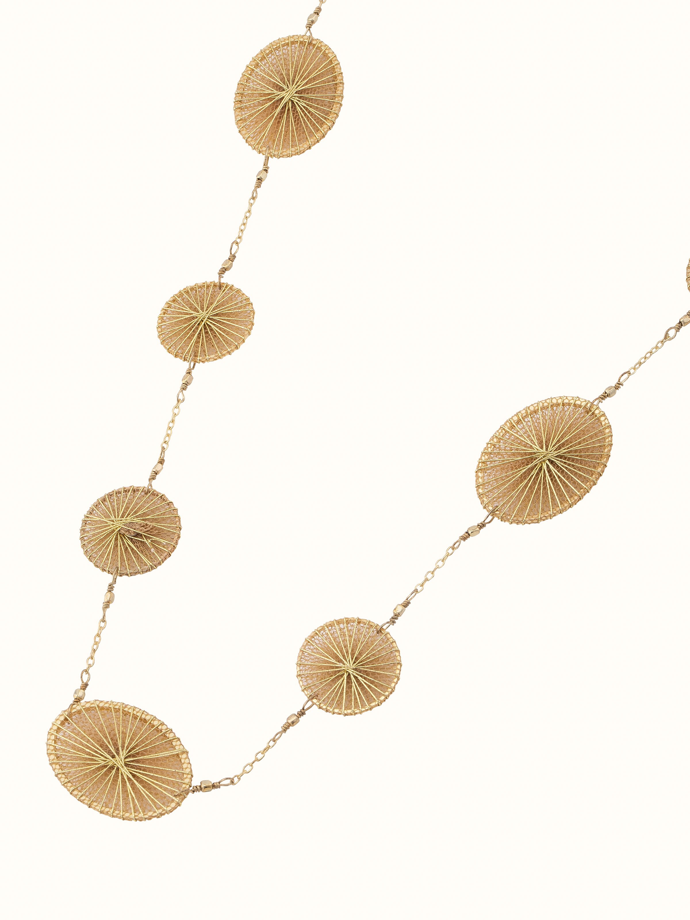Angled view of string craft long necklace emphasizing its elegant and colorful design