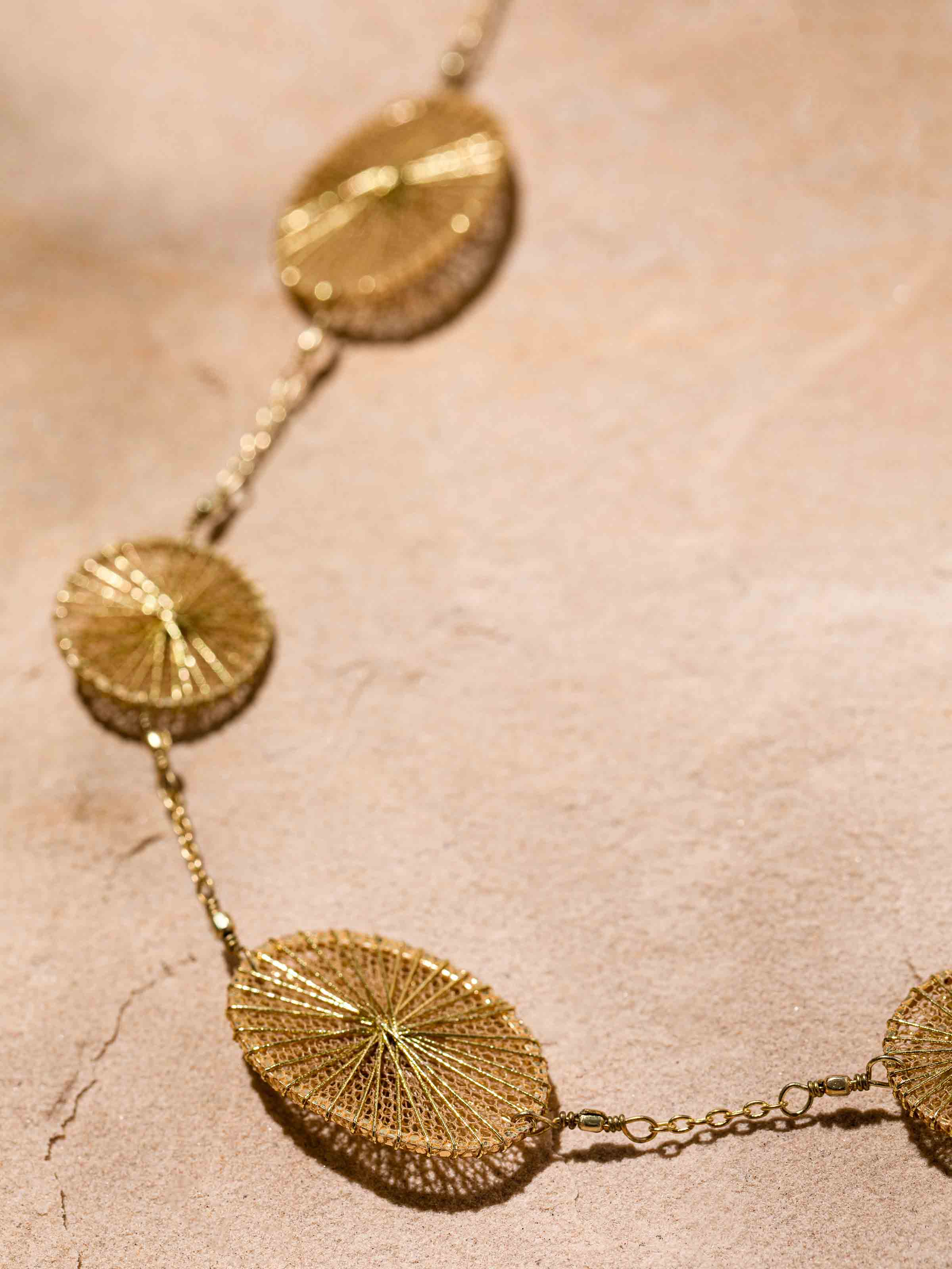 Detailed front view of string craft long necklace showcasing its vibrant and intricate pattern