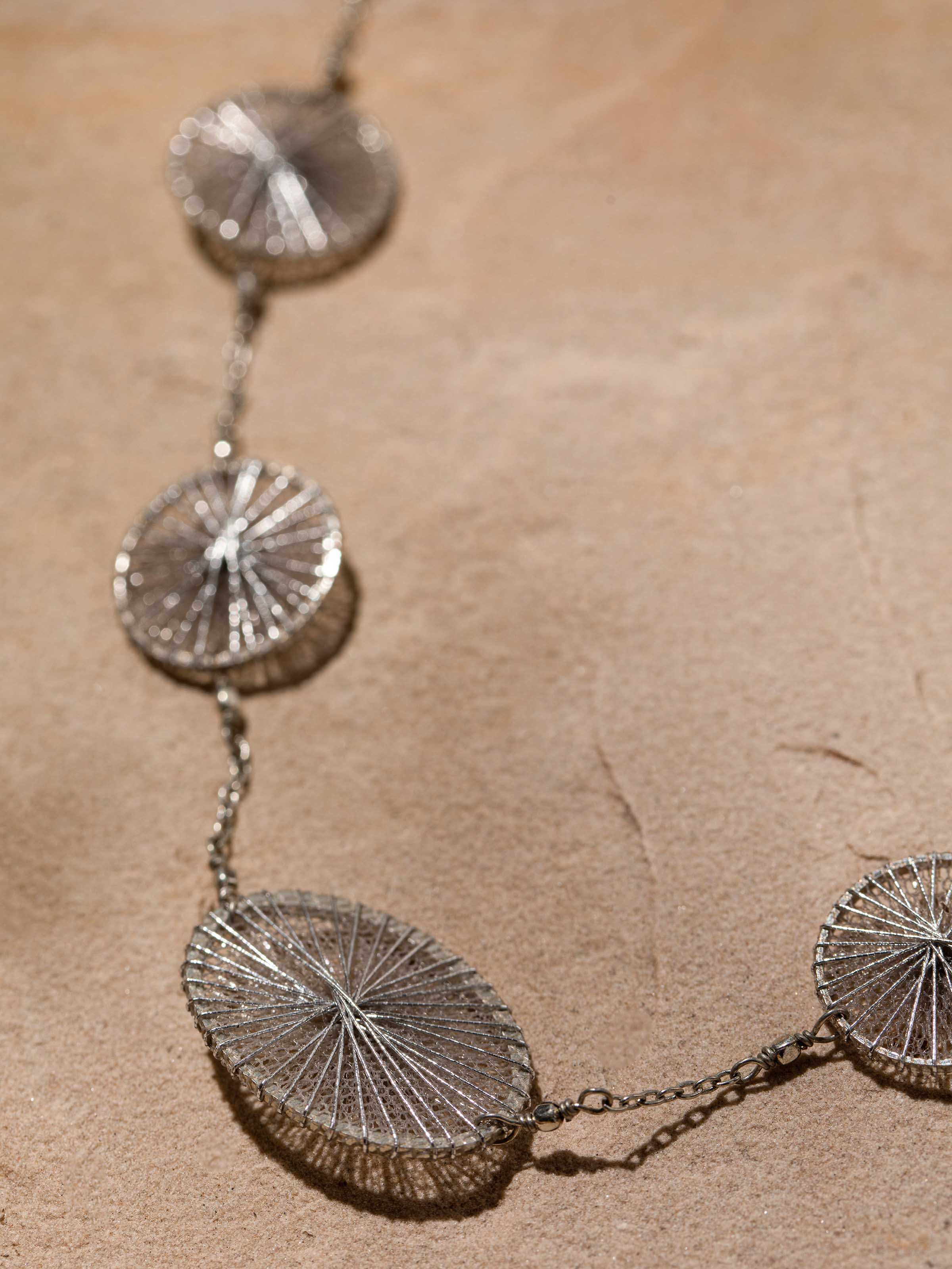 Detailed image of String Craft Long Necklace emphasizing the craftsmanship and vibrant color details.