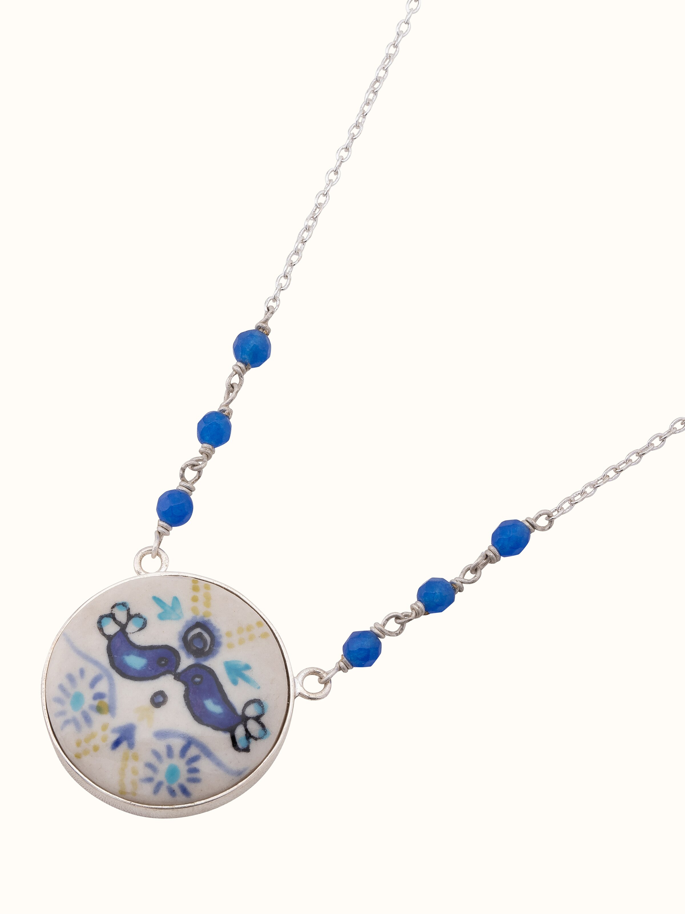 Angled view of Ceramic Long Necklace showcasing the detailed ceramic craftsmanship.