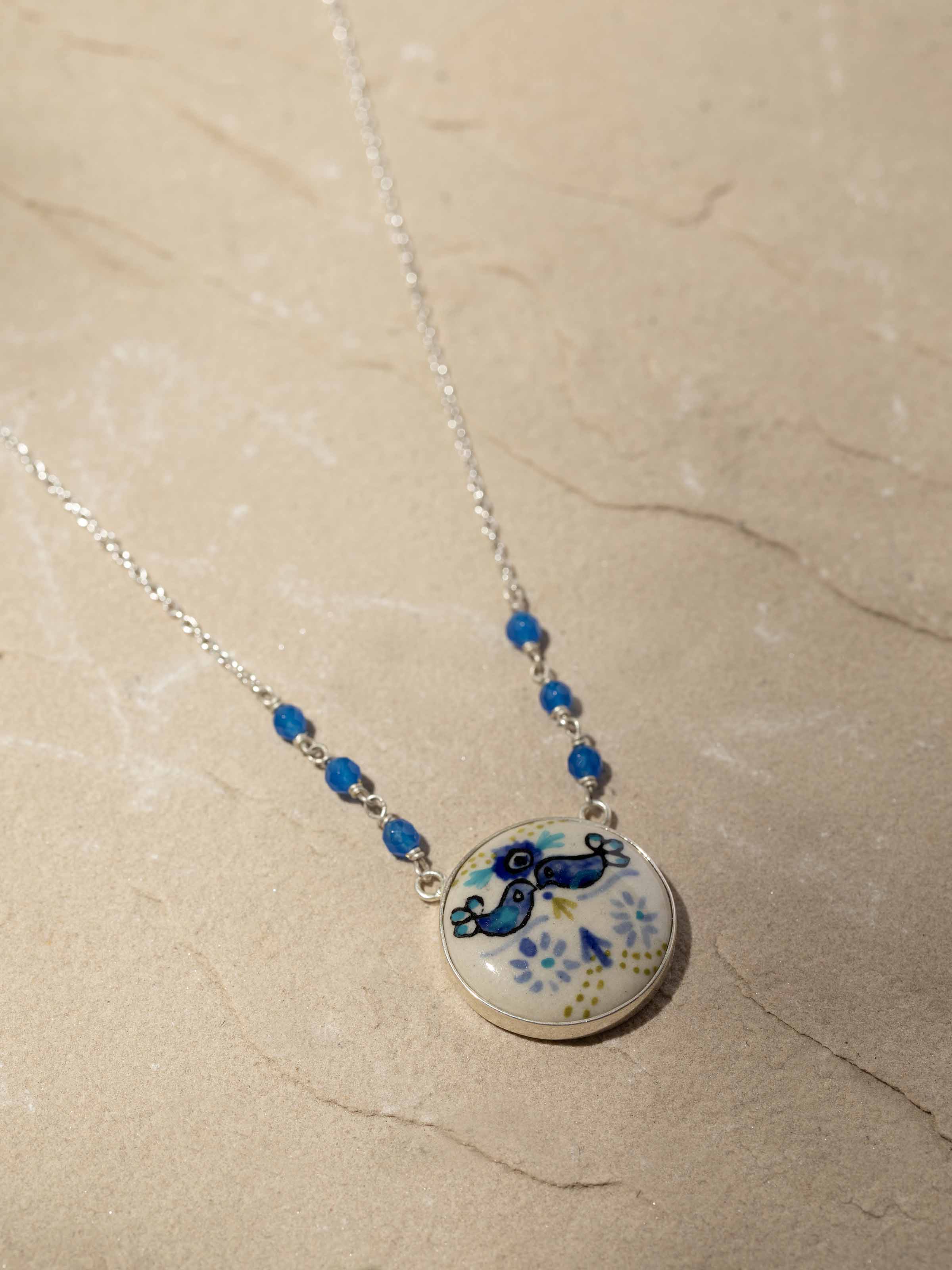 Detailed view of Ceramic Long Necklace highlighting the intricate designs and craftsmanship.