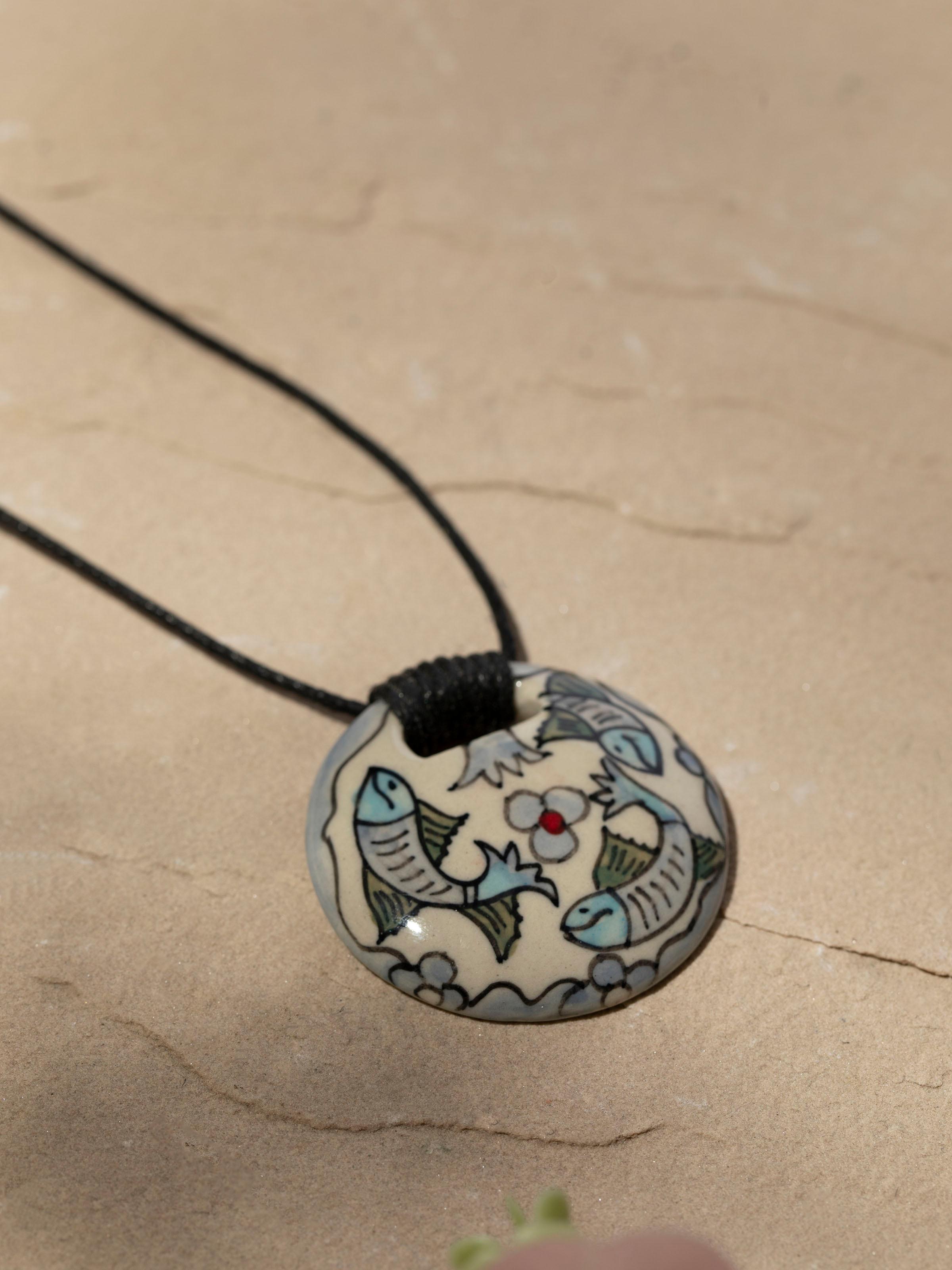 Detailed shot of Ceramic Pendant & Chain focusing on the pendant's intricate design