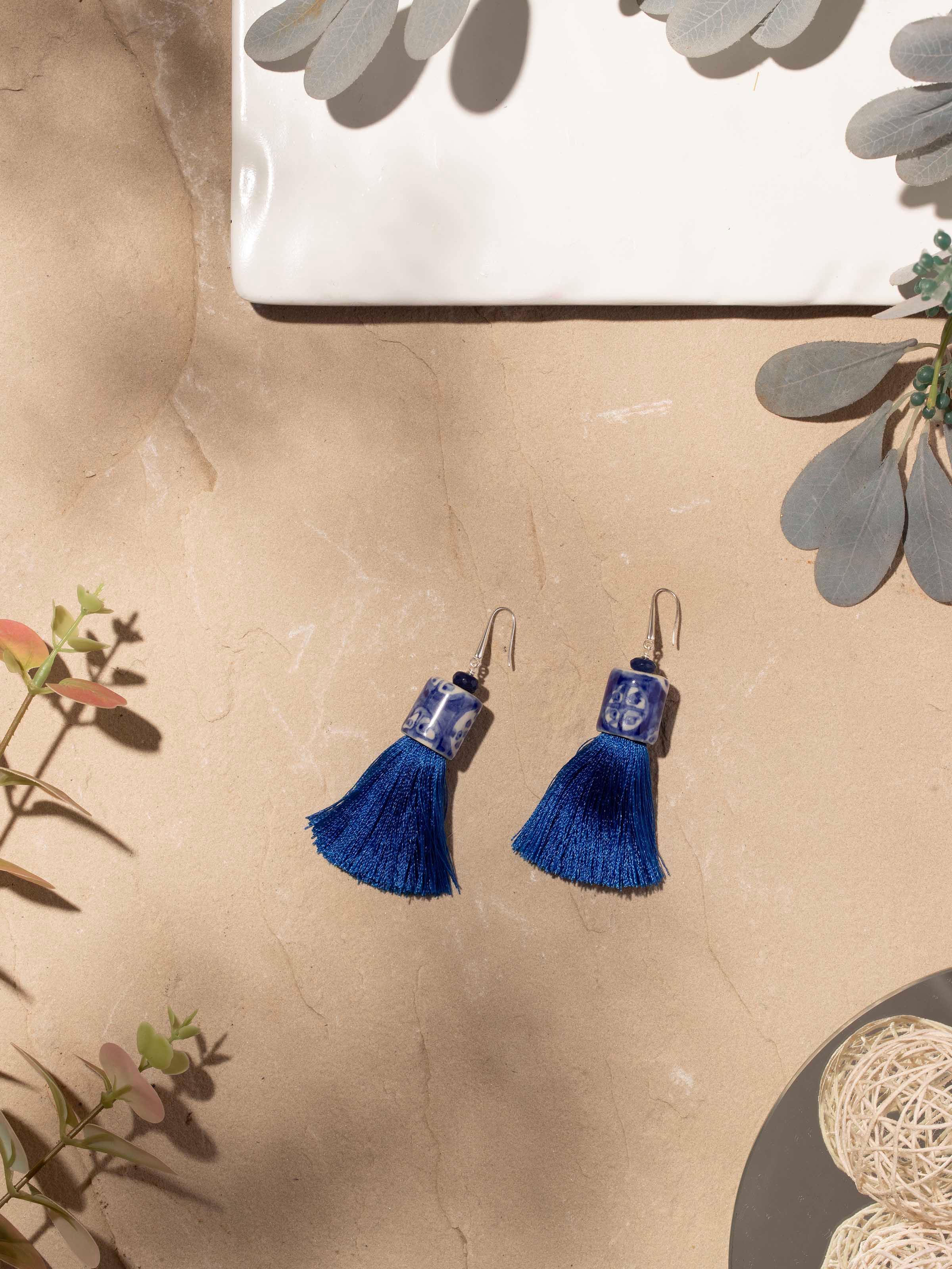 Side view of Ceramic Drop Earrings highlighting intricate ceramic detailing and unique design