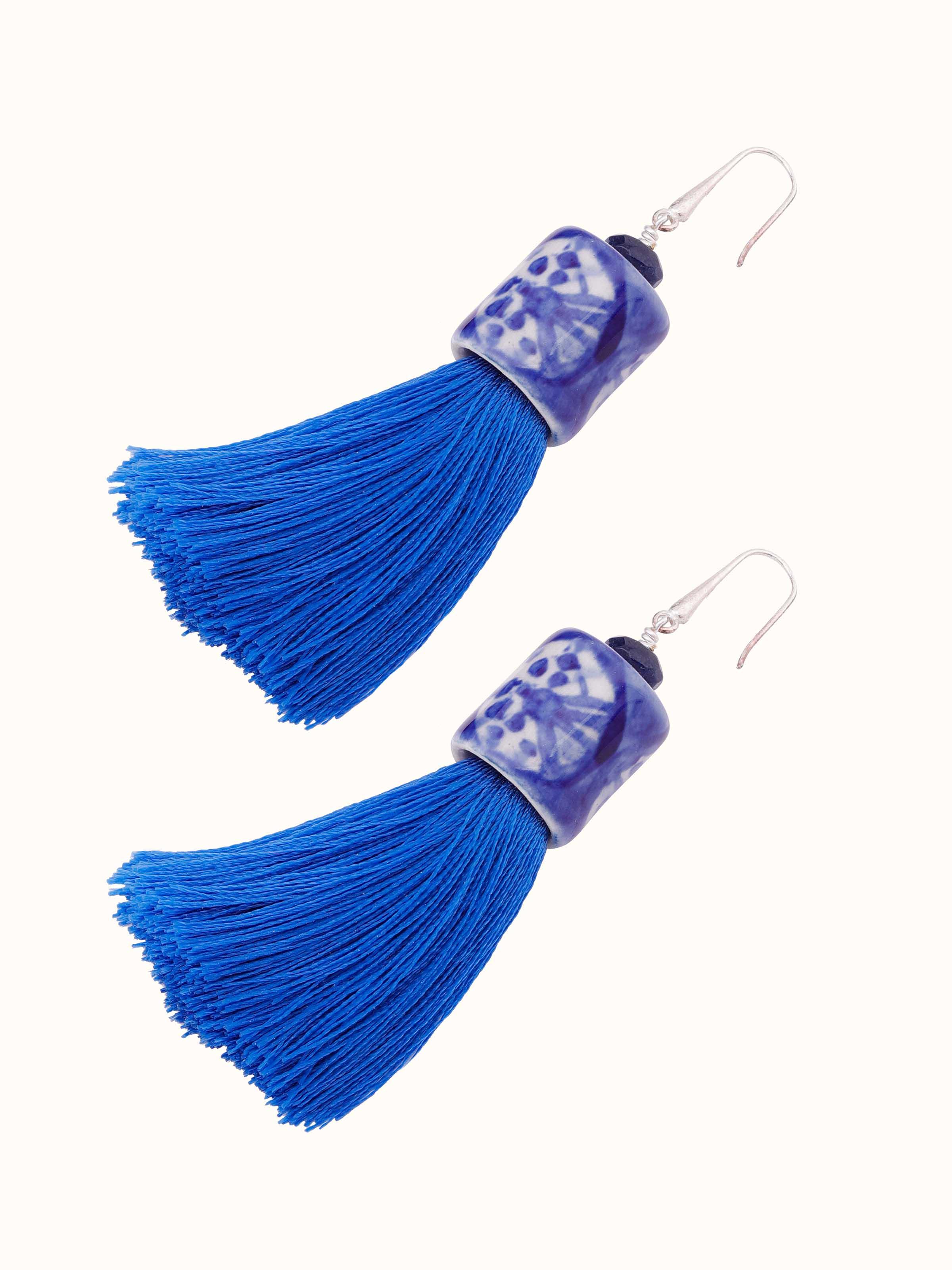 Overhead view of Ceramic Drop Earrings displaying the full design and artistic ceramic patterns