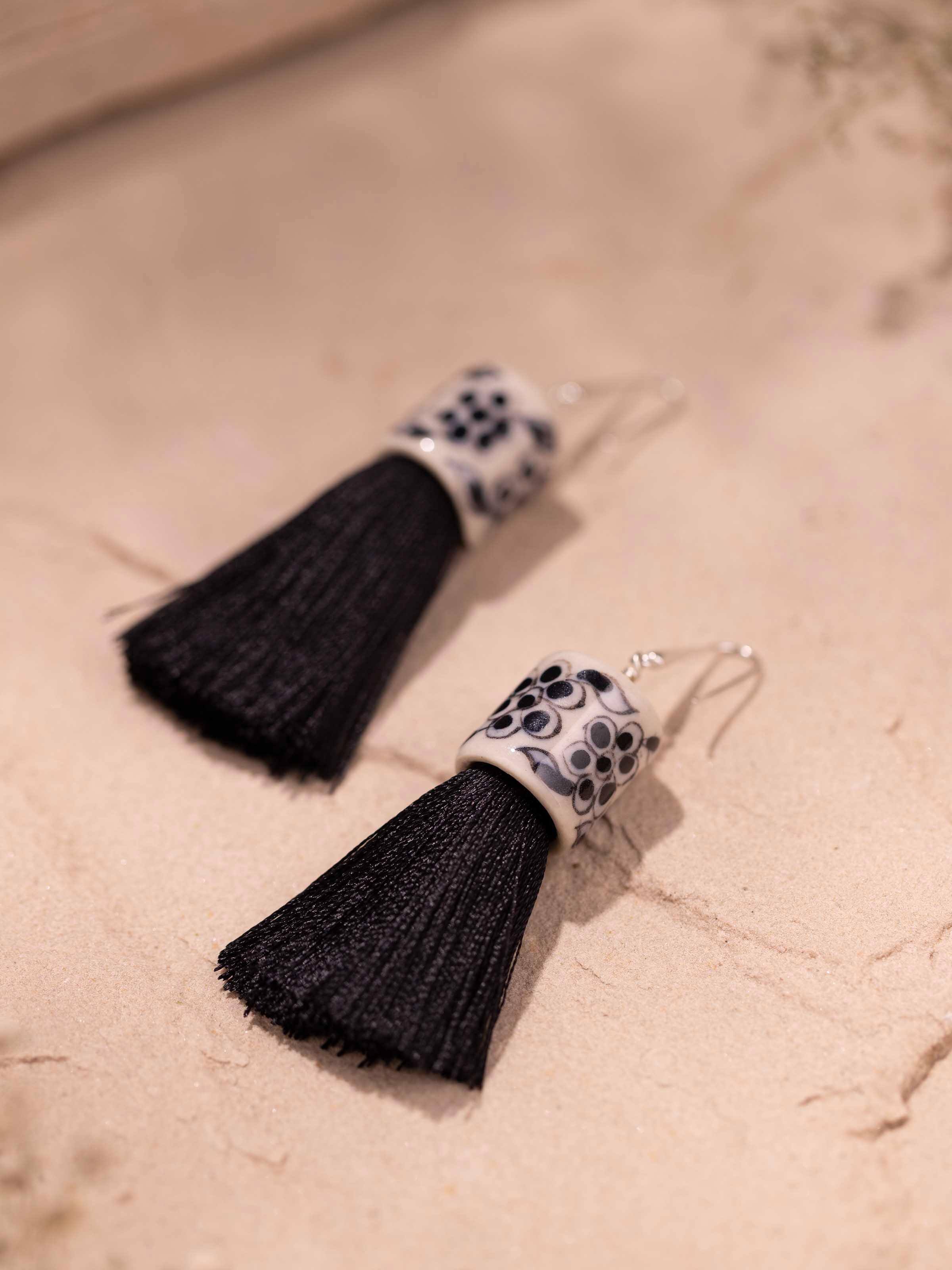Detailed side view of Ceramic Drop Earrings emphasizing the smooth ceramic texture and drop design.