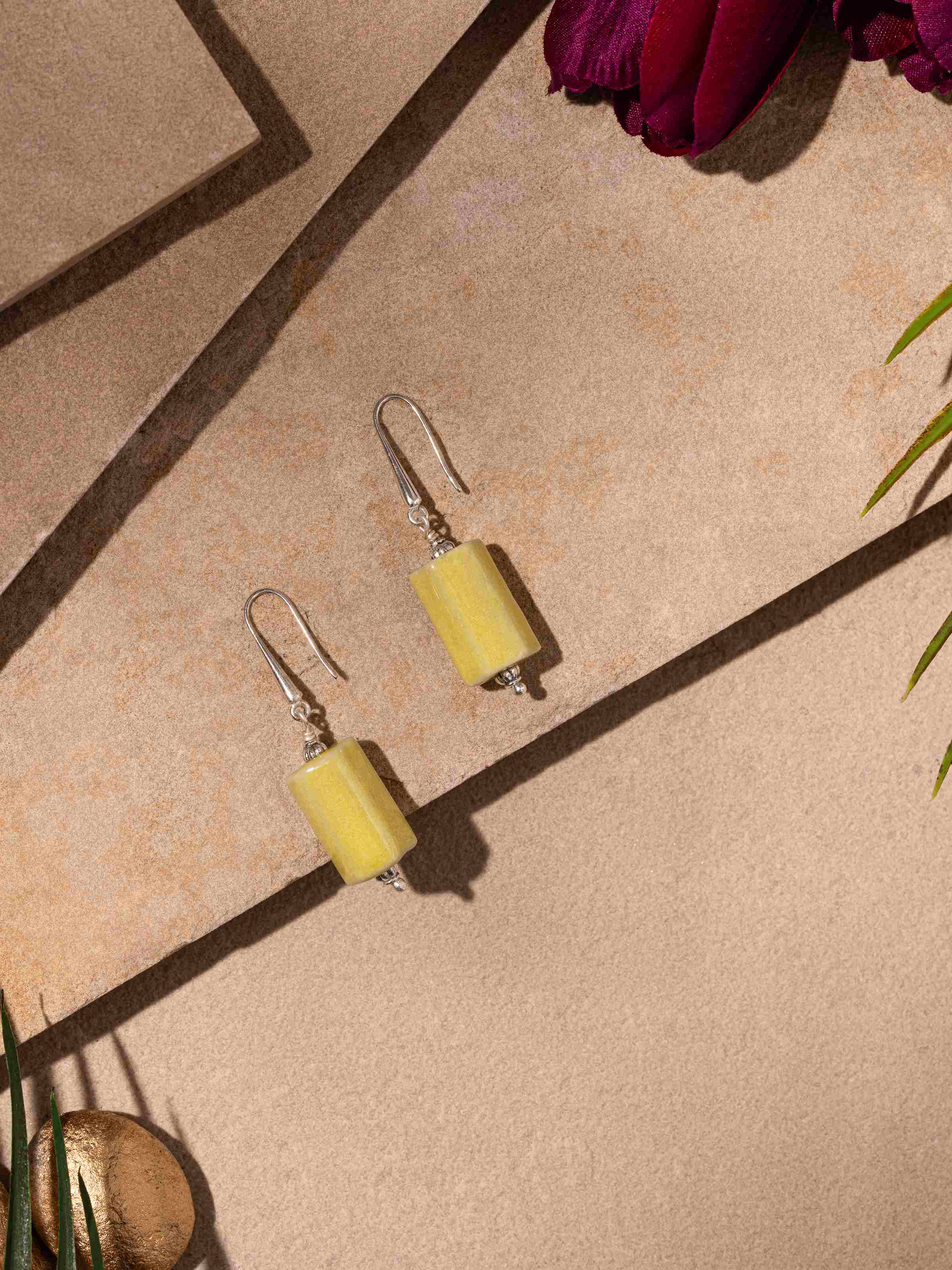 Close-up view of Ceramic drop earrings focusing on their intricate ceramic patterns and stylish design