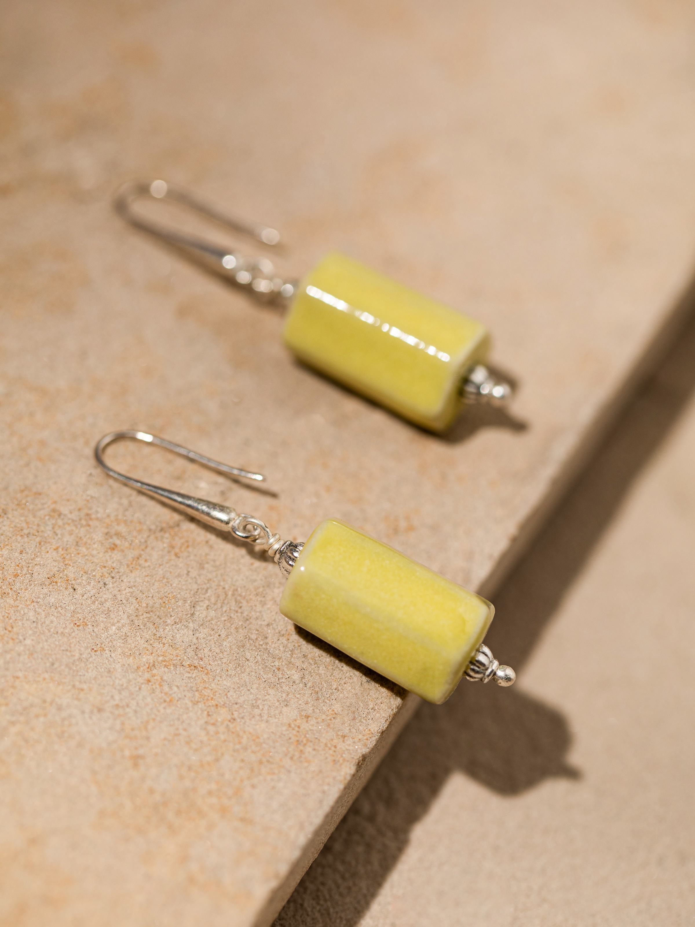 Detailed front view of Ceramic drop earrings highlighting their modern ceramic design and artisanal quality