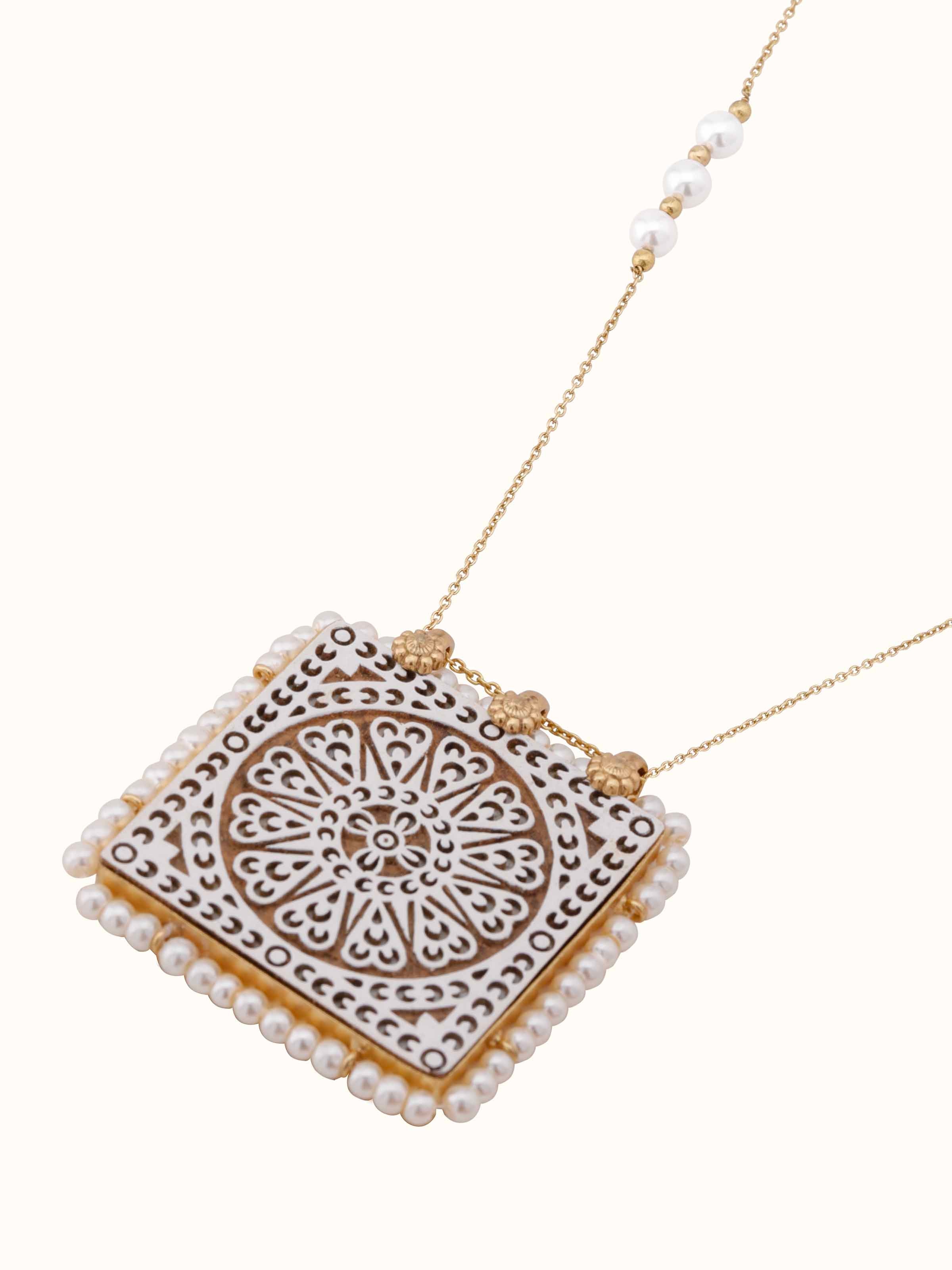 Overhead view of Wood Block Carving Long Necklace revealing artistic details