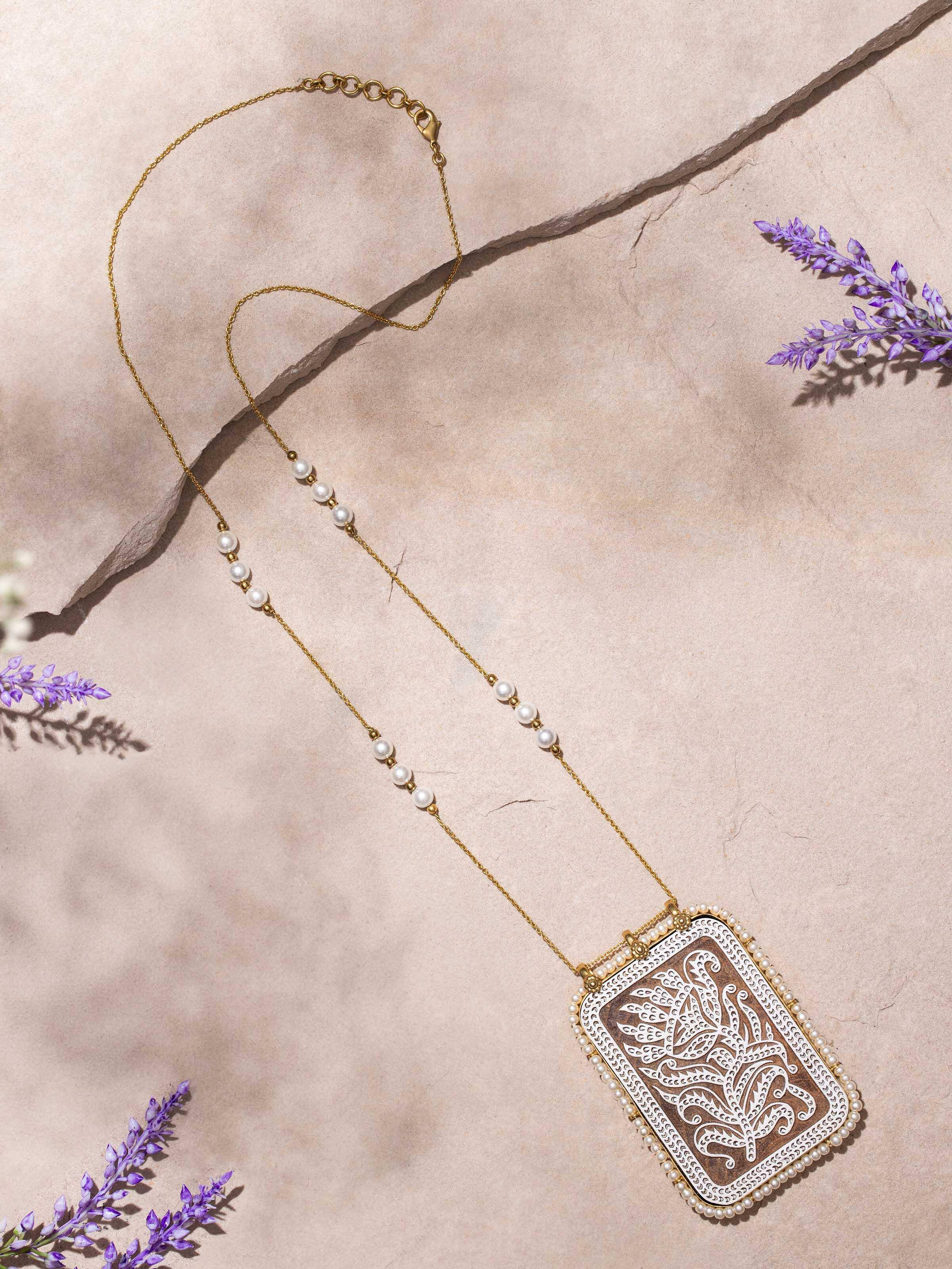 Close-up view of Wood Block Carving Long Necklace emphasizing the craftsmanship and detailed wood block carvings.