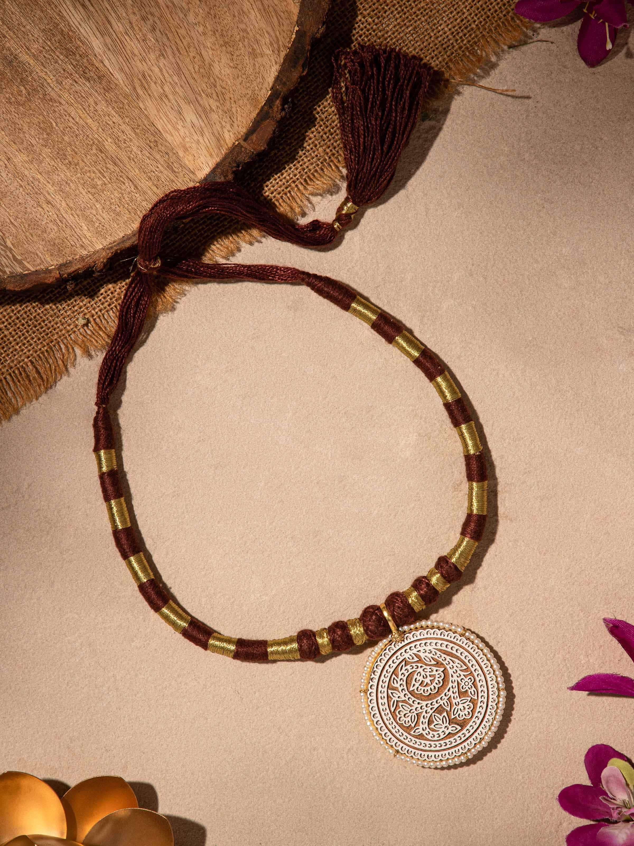 Close-up of Wood Block Carving Collar Necklace emphasizing detailed craftsmanship