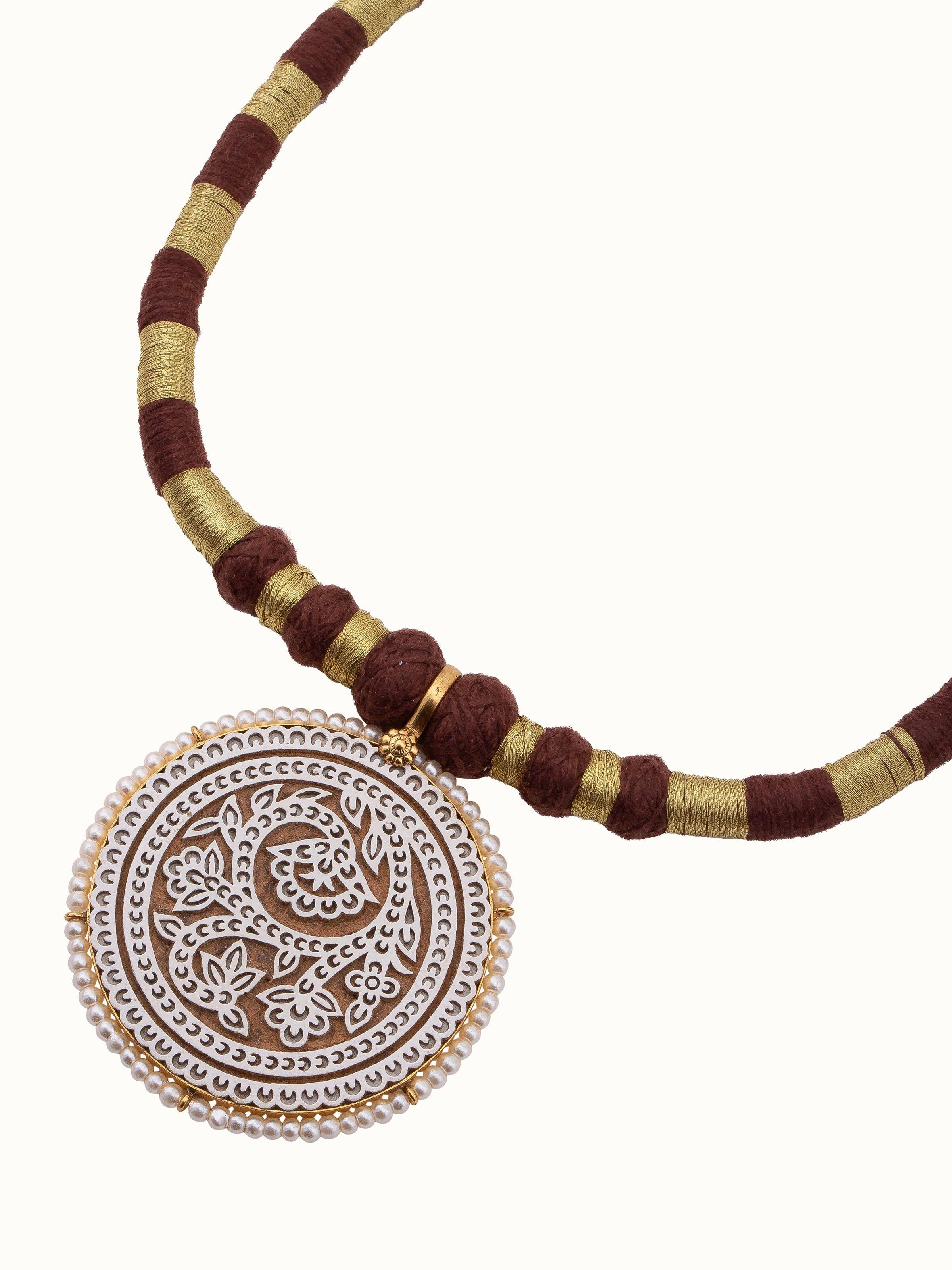 Overhead view of Wood Block Carving Collar Necklace showing overall design