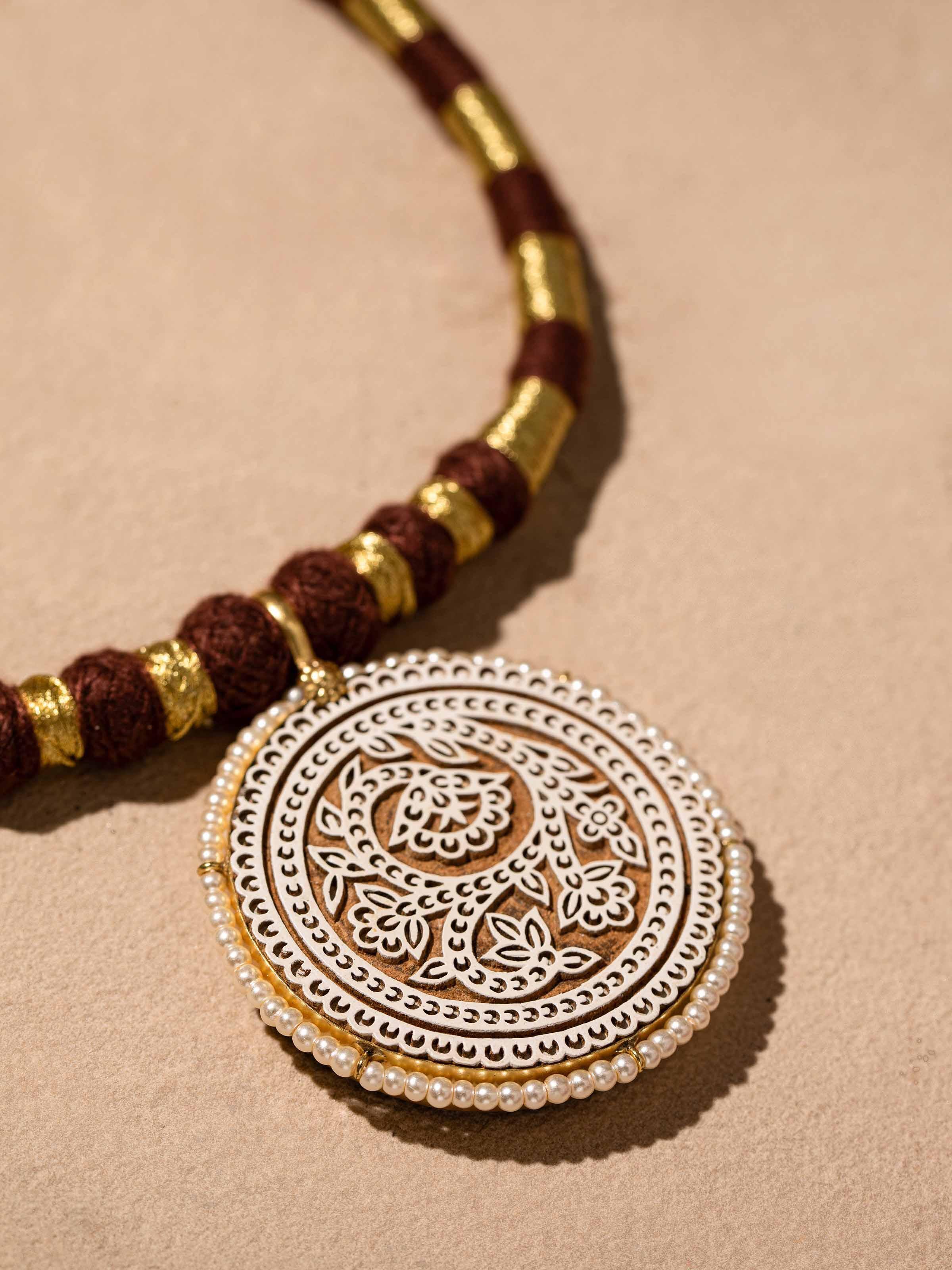 Detailed image of Wood Block Carving Collar Necklace highlighting artisanal work