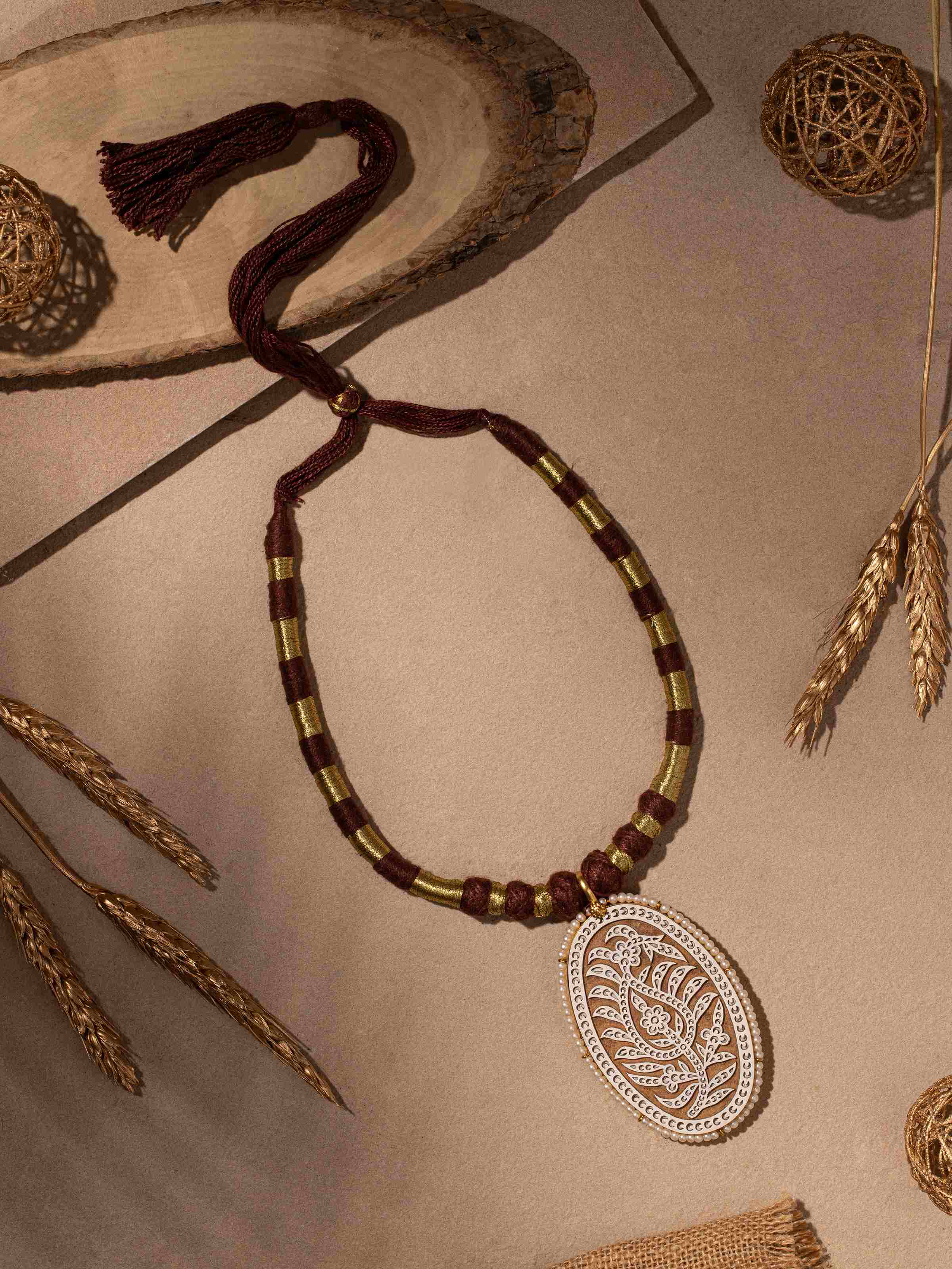 Detailed view of wood block carving collar necklace showcasing the elaborate design.