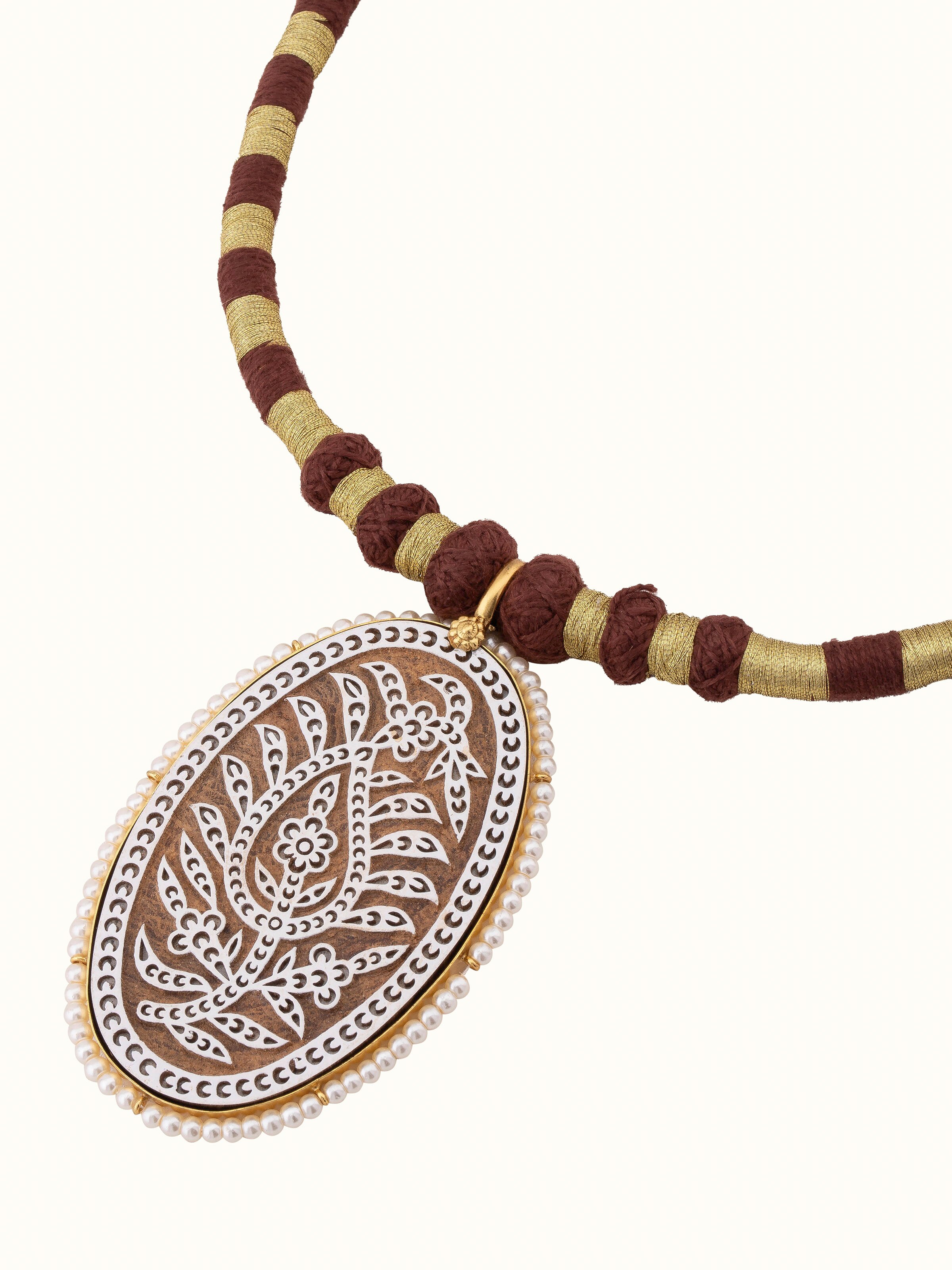 Back view of wood block carving collar necklace showing the secure clasp and detailed design.