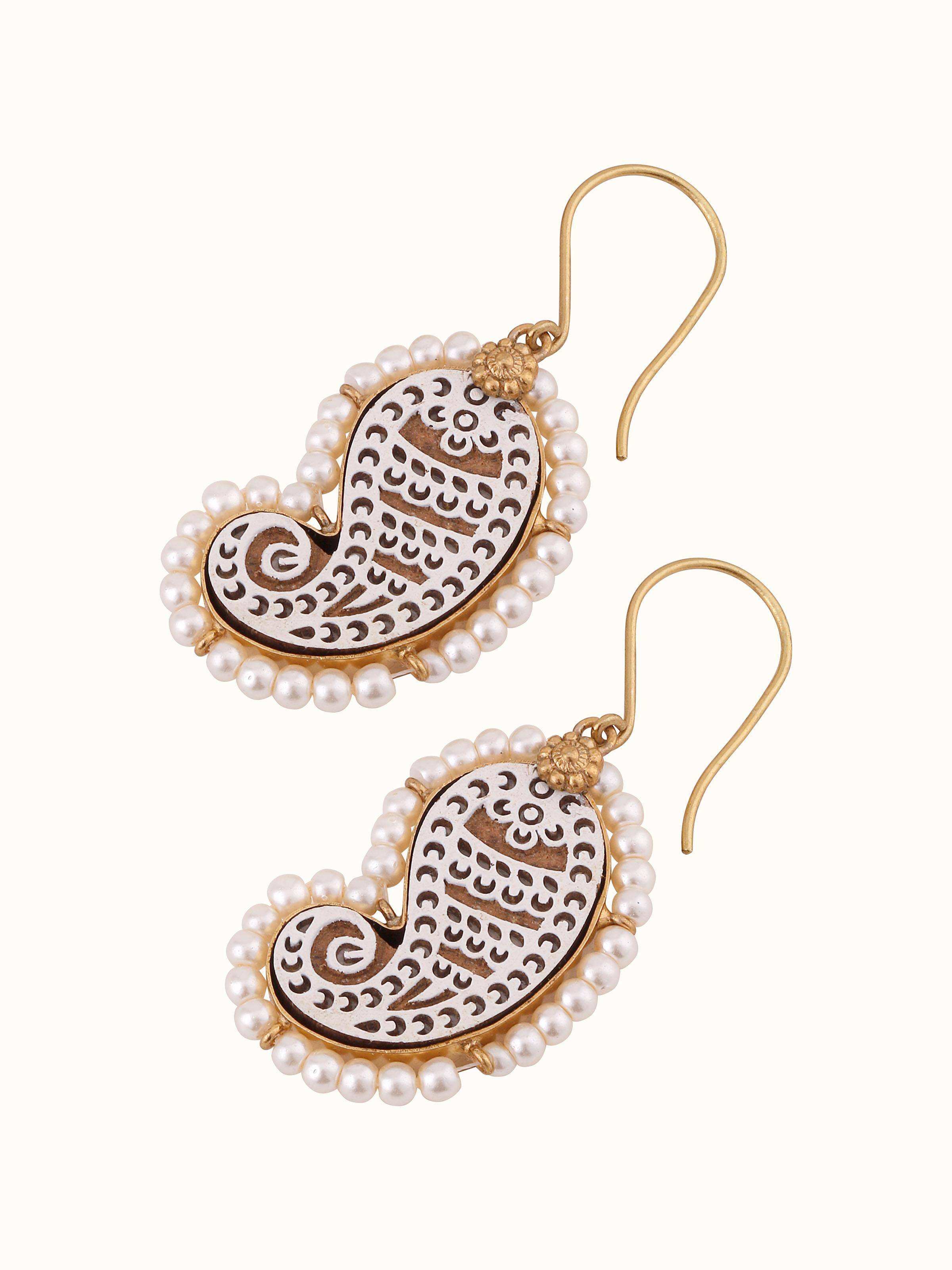 Back view of Wood Block Carving Drop Pair Earrings displaying the earring’s clasp and detailed wood carving.