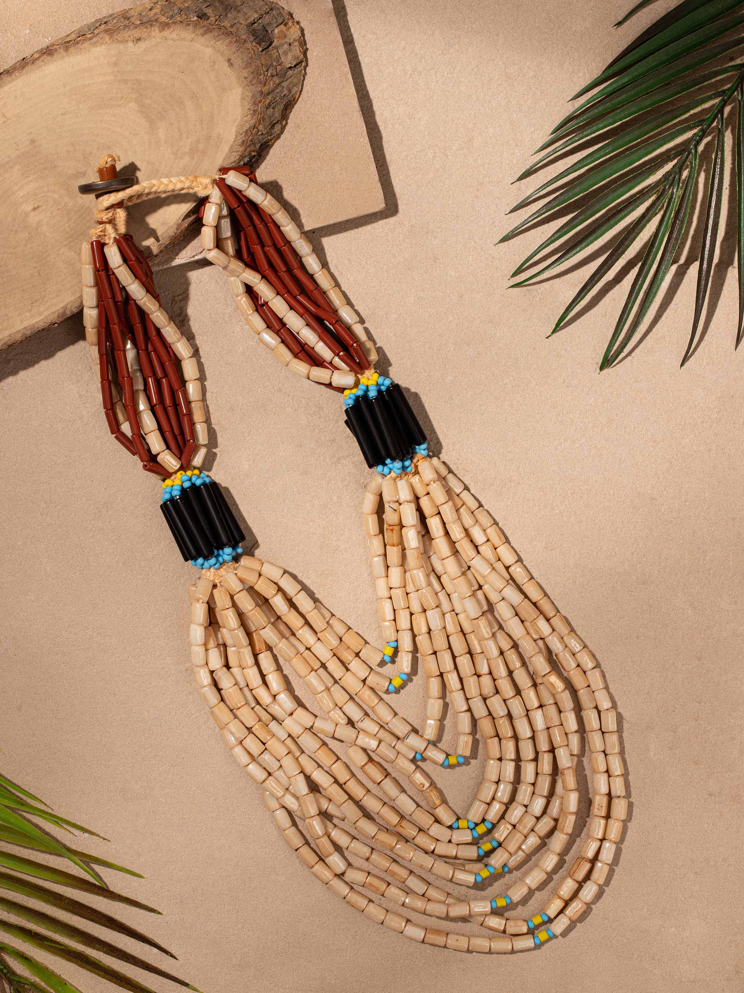 Side view of Bead Long Necklace showcasing its elegant beaded design.