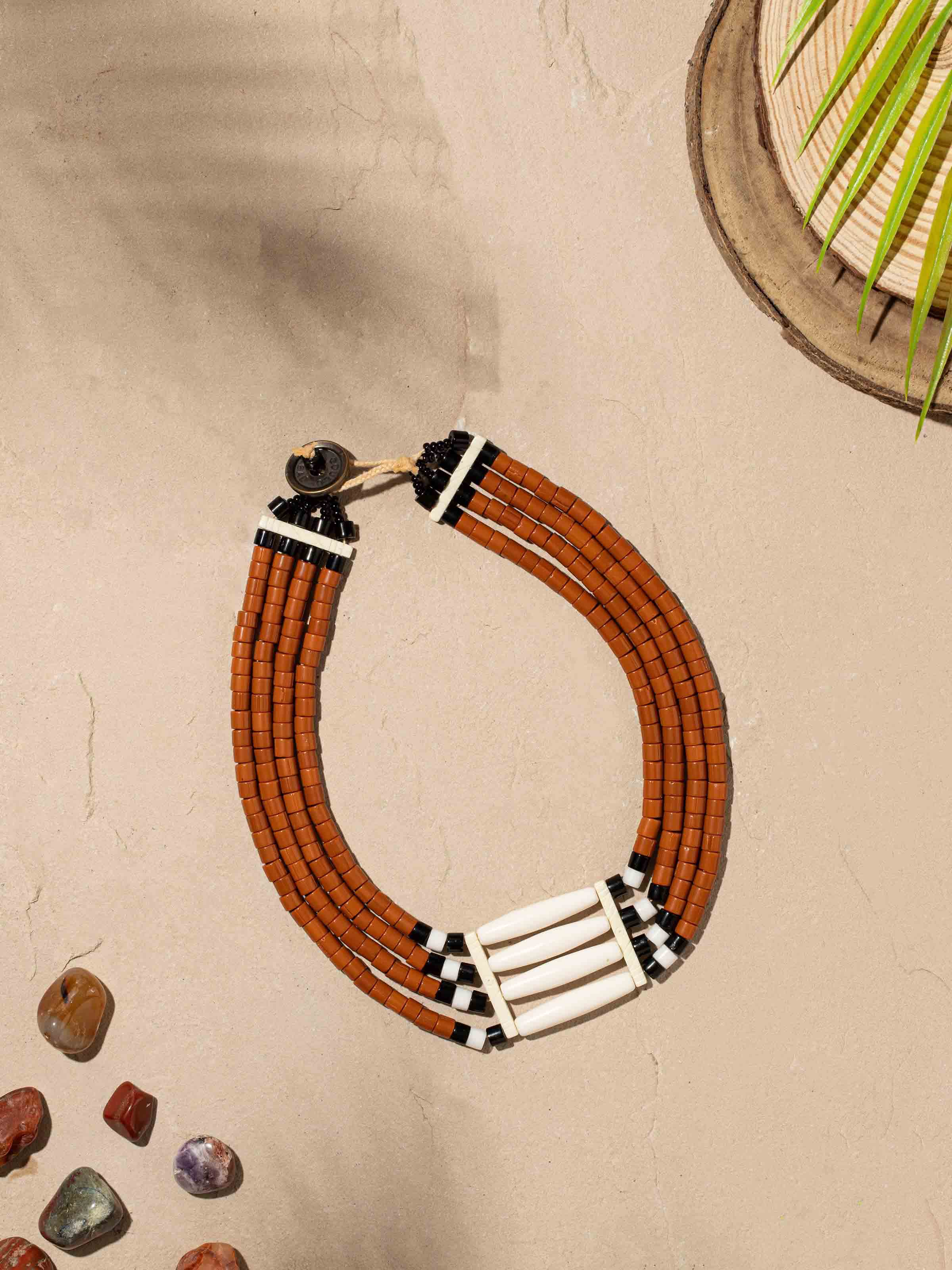 Close-up view of beads and faux bones collar necklace with intricate beadwork