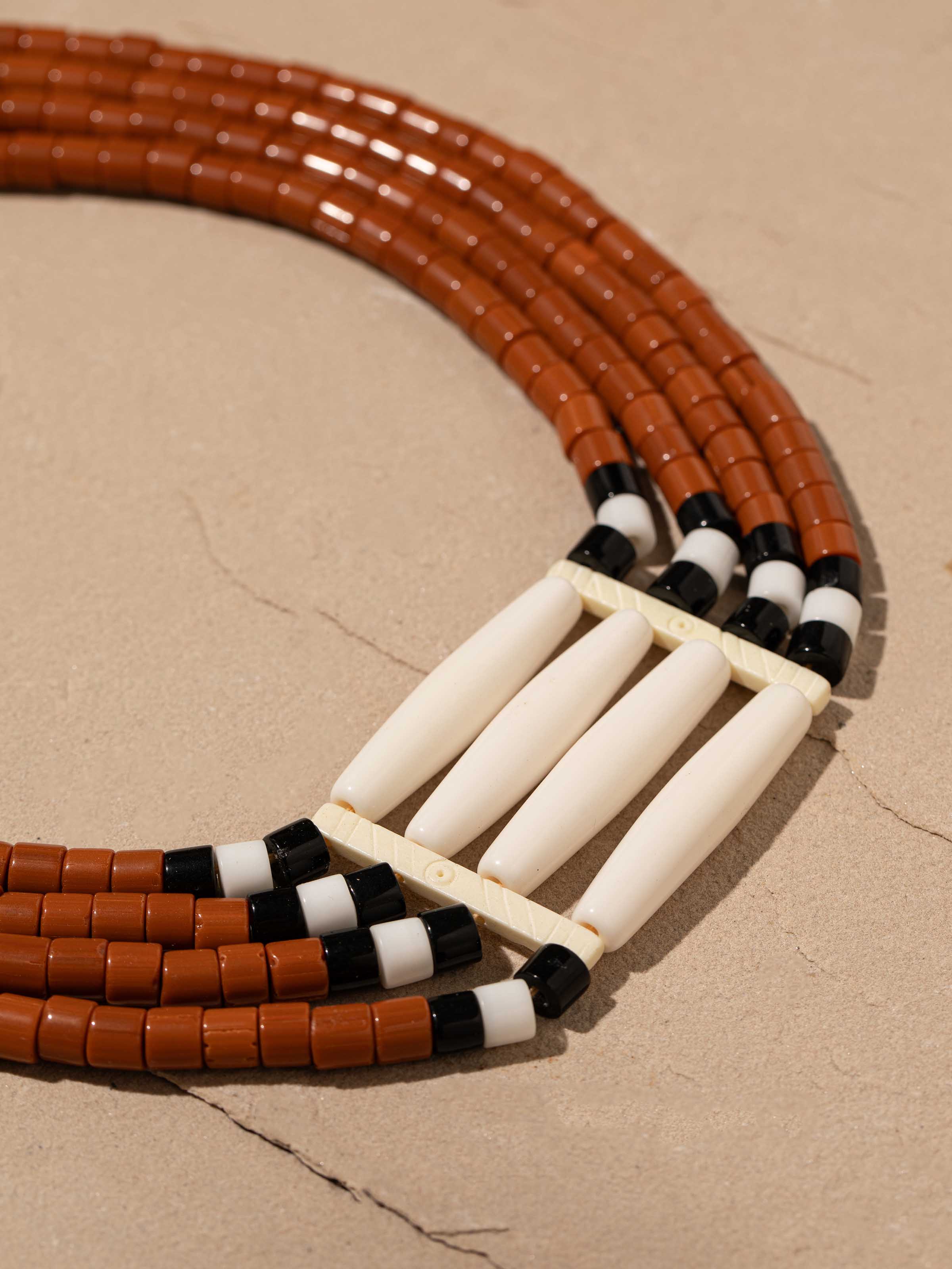 Detailed view of beads and faux bones collar necklace