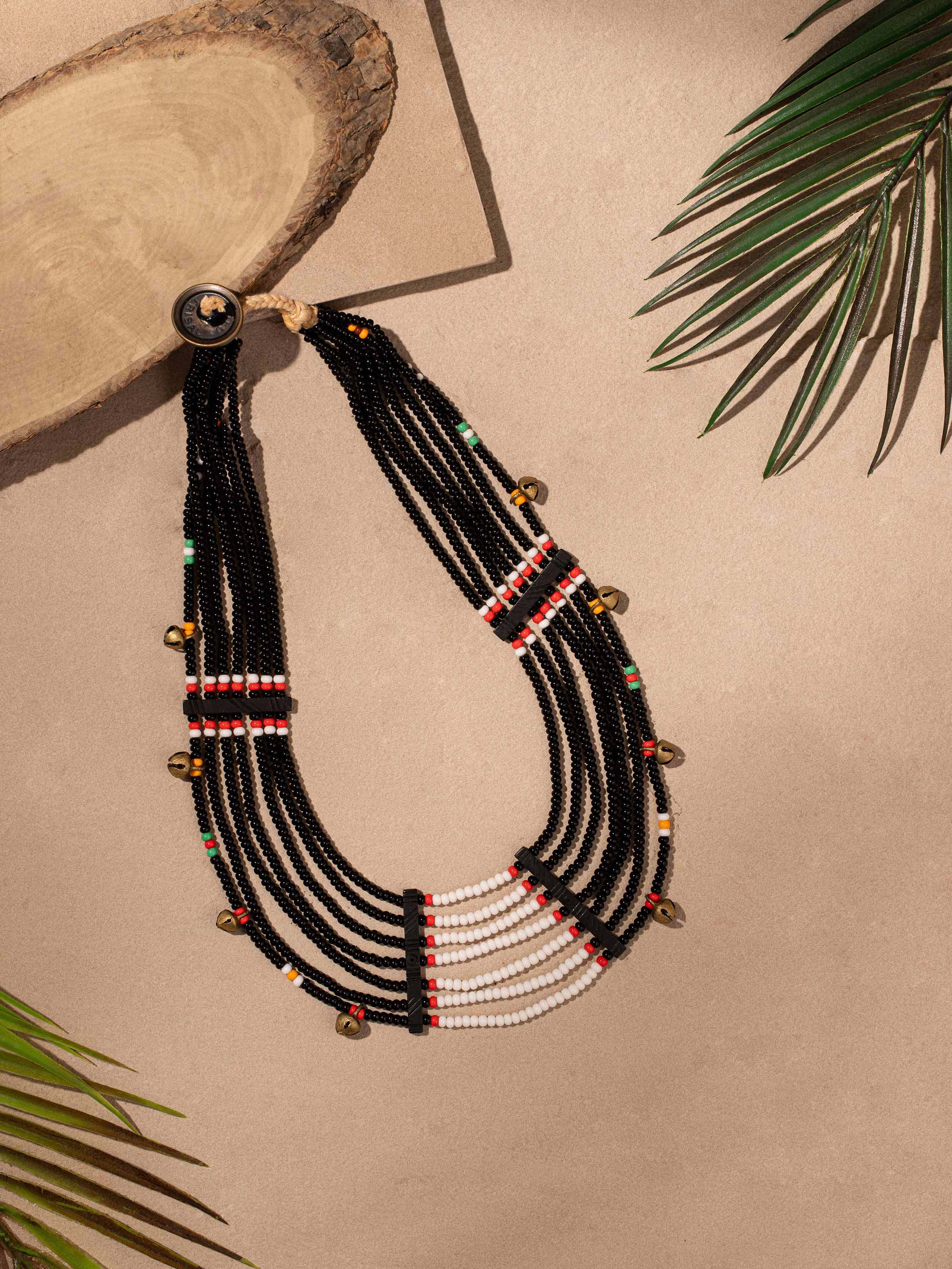 Side view of Beads & Faux Bones Collar Necklace highlighting its layered design and vibrant colors.